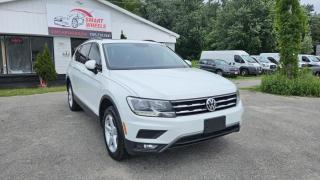 CLEAN CARFAX REPORT No Accidents, Low Mileage<br><br>2021 VOLKSWAGEN TIGUAN COMFORTLINE featuring Navigation, Back up Camera, Adaptive Cruise Control, Hand free phone, Panoramic Sunroof, Heated seats, Dual Air Conditioning, Engine Auto Stop-Start Feature, FCW w/Autonomous Emergency Braking, Tilt/Telescoping Steering Column, Tracker System,  Leather/Metal-Look Steering Wheel,  Alloy Wheels, Fixed Rear Window w/Fixed Interval Wiper and Defroster, Deep Tinted Glass, Variable Intermittent Wipers w/Heated Wiper Park, Galvanized Steel Panels, Auto On/Off Reflector Halogen Daytime Running Headlamps w/Delay-Off, Roof Rack Rails Only, Keyless Entry, Power Windows and more.<br><br>Purchase price: $26,888  plus HST and LICENSING<br><br>Safety package is available for $799 and includes Ontario Certification, 3 month or 3000 km Lubrico warranty ($1000 per claim) and oil change.<br>If not certified, by OMVIC regulations this vehicle is being sold AS-lS and is not represented as being in road worthy condition, mechanically sound or maintained at any guaranteed level of quality. The vehicle may not be fit for use as a means of transportation and may require substantial repairs at the purchaser   s expense. It may not be possible to register the vehicle to be driven in its current condition.<br><br>CARFAX PROVIDED FOR EVERY VEHICLE<br><br>WARRANTY: Extended warranty with variety terms and coverages is available, please ask our representative for more details.<br>FINANCING: Regardless of your credit score, we are committed to assisting you in obtaining a customized car loan that suits your specific circumstances. Our goal is to help you enhance your credit score significantly by the time you complete your loan term. Our specialists are happy to assist you with all necessary information.<br>TRADE-IN OR SELL: Upgrade your ride by trading-in your vehicle and save on taxes, or Sell it to us, and get the best value for your current vehicle.<br><br>Smart Wheels Used Car Dealership     OMVIC Registered Dealer<br>642 Dunlop St West, Barrie, ON L4N 9M5<br>Phone: 705-721-1341 ext 201<br>Email: Info@swcarsales.ca<br>Web: www.swcarsales.ca<br>Terms and conditions may apply. Price and availability subject to change. Contact us for the latest information<br>