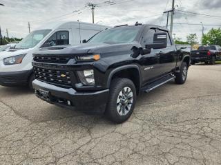 Black 2023 Chevrolet Silverado 2500HD Custom 4D Crew Cab 6.6L V8 6-Speed Automatic 4WD 6-Speed Automatic, 4WD, Jet Black w/Cloth Seat Trim, 170 Amp Alternator, 2-Speed Electronic Shift Transfer Case, 3.5 Diagonal Monochromatic Display DIC, 3.73 Rear Axle Ratio, 4-Wheel Disc Brakes, 6 Speakers, 6-Speaker Audio System, 720 Cold-Cranking Amps Heavy-Duty Battery, ABS brakes, Air Conditioning, Alloy wheels, AM/FM radio, Apple CarPlay/Android Auto, Auto-Dimming Inside Rear-View Mirror, Black Chevytec Spray-On Bedliner, Black Mirror Caps, Bluetooth® For Phone, Body Colour Front Grille, Brake assist, Chevrolet Connected Access Capable, Cloth Seat Trim, Colour-Keyed Carpeting Floor Covering, Compass, Custom Convenience Package, Custom Value Package, Deep-Tinted Glass, Delay-off headlights, Driver door bin, Dual front impact airbags, Dual front side impact airbags, Electric Rear-Window Defogger, Electronic Cruise Control w/Set & Resume Speed, Electronic Stability Control, Engine Block Heater, Exterior Parking Camera Rear, EZ Lift Power Lock & Release Tailgate, Front 40/20/40 Split-Bench Seats, Front anti-roll bar, Front reading lights, Front Rubberized Vinyl Floor Mats, Front wheel independent suspension, Fully automatic headlights, Gooseneck/5th Wheel Package, Gooseneck/5th Wheel Prep Package, Heated door mirrors, Heated Vertical Trailering Mirrors, Illuminated entry, Infotainment Package, Integrated Trailer Brake Controller, LED Cargo Area Lighting, Locking Tailgate, Low tire pressure warning, Manual Tailgate Function w/No EZ Lift, Manual Tilt-Wheel Steering Column, Occupant sensing airbag, OnStar & Chevrolet Connected Services Capable, Outside temperature display, Overhead airbag, Overhead console, Panic alarm, Passenger door bin, Passenger vanity mirror, Power Door Locks, Power door mirrors, Power Front Windows w/Driver Express Up/Down, Power Front Windows w/Passenger Express Down, Power Rear Windows w/Express Down, Power steering, Power windows, Power-Adjustable Vertical Trailering Mirrors, Preferred Equipment Group 1CX, Radio: Chevrolet Infotainment 3 System, Rear 60/40 Folding Bench Seat (Folds Up), Rear reading lights, Rear Rubberized Vinyl Floor Mats, Rear step bumper, Remote Keyless Entry, Remote keyless entry, Remote Vehicle Starter System, SiriusXM, Speed control, Split folding rear seat, Standard Tailgate, Suspension Package, Tachometer, Tilt steering wheel, Traction control, Trip computer, Turn signal indicator mirrors, Variably intermittent wipers, Voltmeter, Wheels: 20 10-Spoke Machined Aluminum, Wi-Fi Hotspot Capable.