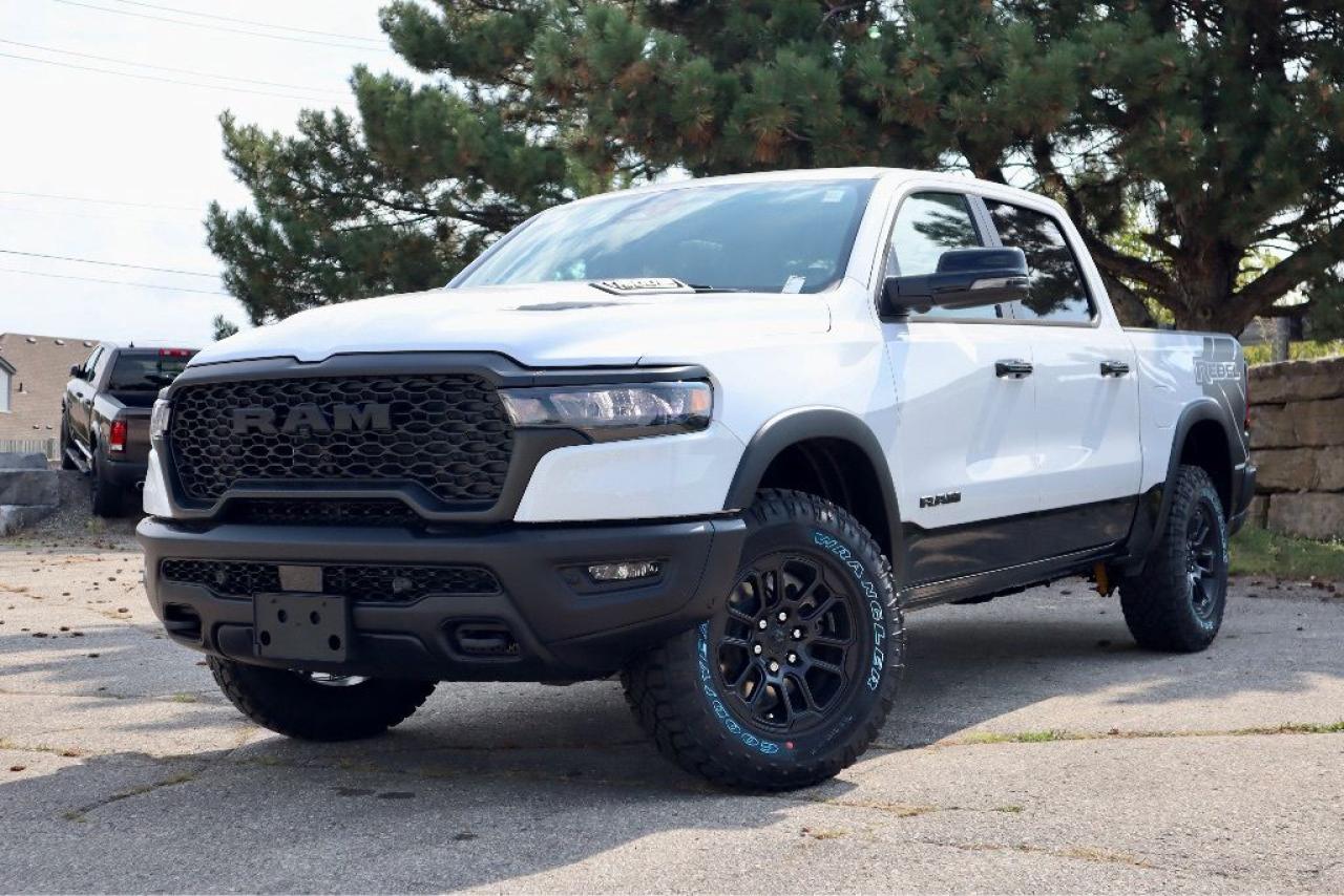 An additional $998 for dealer installed running boards and $799 for spray-in liner will be applied to pricing.

Dynamic and defiant, our New 2025 RAM 1500 Rebel Crew Cab 4X4 with the Level 2 Pack in Bright White w/ Diamond Black Crystal Pearl Two-Tone dares you to find your limits on the trail or off! Motivated by a Twin-TurboCharged 3.0 Litre Hurricane 6 Cylinder delivering 420hp to an 8 Speed Automatic transmission engineered for off-road domination. A raised ride height, performance shocks, and a shift-on-demand transfer case can take this Four Wheel Drive truck further down the trail, and it achieves approximately 9.8L/100km on the highway. Our fierce RAM features LED lighting, a sport performance hood, bold graphics, alloy wheels, off-road fender flares, robust skid plates, a Class IV trailer hitch, a sunroof, and our Level 2 Pack for multifunction mirrors and a power tailgate.

Thanks to our Level 2 Pack, our Rebel cabin is ready for rough terrain. It adds heated leather power front and heated rear seats, a heated leather steering wheel, a 14.4-inch touchscreen, power-adjustable pedals, dual-phone wireless charging, and Harman Kardon audio to dual-zone automatic climate control, a power rear window, Off-Road Info Pages, a 12-inch driver display, full-color navigation, Apple CarPlay®/Android Auto®, WiFi compatibility, Bluetooth®, and voice control.

For safetys sake, RAM supplies front/rear auto braking, blind-spot monitoring, adaptive cruise control, active lane management, trailer sway damping, hill-start assistance, and more. Committed to truck leadership, our 1500 Rebel is a compelling choice! Save this Page and Call for Availability. We Know You Will Enjoy Your Test Drive Towards Ownership!