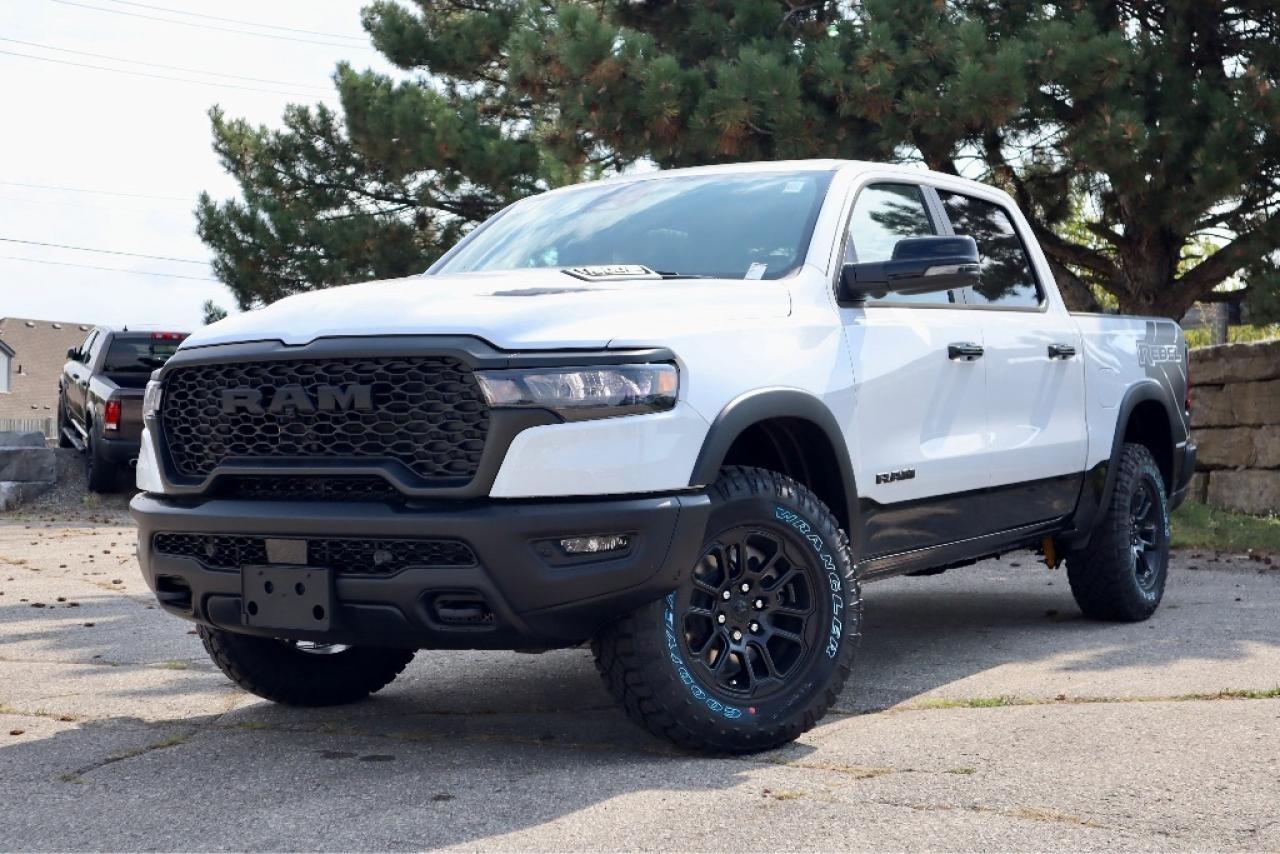 An additional $998 for dealer installed running boards, $949 tri-fold tonneau and $799 for spray-in liner will be applied to pricing.

Dynamic and defiant, our New 2025 RAM 1500 Rebel Crew Cab 4X4 with the Level 2 Pack in Bright White w/ Diamond Black Crystal Pearl Two-Tone dares you to find your limits on the trail or off! Motivated by a Twin-TurboCharged 3.0 Litre Hurricane 6 Cylinder delivering 420hp to an 8 Speed Automatic transmission engineered for off-road domination. A raised ride height, performance shocks, and a shift-on-demand transfer case can take this Four Wheel Drive truck further down the trail, and it achieves approximately 9.8L/100km on the highway. Our fierce RAM features LED lighting, a sport performance hood, bold graphics, alloy wheels, off-road fender flares, robust skid plates, a Class IV trailer hitch, a sunroof, and our Level 2 Pack for multifunction mirrors and a power tailgate.

Thanks to our Level 2 Pack, our Rebel cabin is ready for rough terrain. It adds heated leather power front and heated rear seats, a heated leather steering wheel, a 14.4-inch touchscreen, power-adjustable pedals, dual-phone wireless charging, and Harman Kardon audio to dual-zone automatic climate control, a power rear window, Off-Road Info Pages, a 12-inch driver display, full-color navigation, Apple CarPlay®/Android Auto®, WiFi compatibility, Bluetooth®, and voice control.

For safetys sake, RAM supplies front/rear auto braking, blind-spot monitoring, adaptive cruise control, active lane management, trailer sway damping, hill-start assistance, and more. Committed to truck leadership, our 1500 Rebel is a compelling choice! Save this Page and Call for Availability. We Know You Will Enjoy Your Test Drive Towards Ownership!