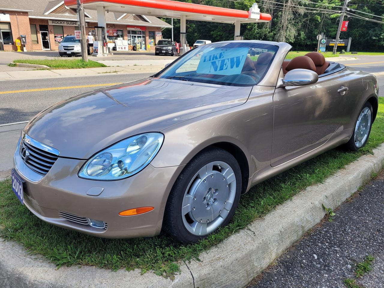 <p>Accident Free, Certified, Financing Available & Trade-ins Welcome!</p><p>&nbsp;MICHELIN Pilot Sport A/S Plus Tires</p><p>Step into luxury and style with this 2003 Lexus SC 430 convertible, a stunning example of timeless design and powerful performance. This meticulously maintained beauty boasts a sleek beige exterior and a sophisticated brown leather interior, providing an elegant and inviting atmosphere for every journey. The 4.3L V8 engine roars to life with a satisfying growl, while the smooth automatic transmission ensures effortless transitions through the gears. With a clean Carfax report and 158,000 km on the odometer, this SC 430 is ready for many more adventures.</p><p>Experience the thrill of open-air driving with the ease of a power-retractable hardtop, offering the best of both worlds. Enjoy the convenience of features like GPS navigation, heated seats, and a premium sound system, making every drive a delight. This Lexus SC 430 is a true head-turner, offering a perfect blend of classic sophistication and modern comforts. Come visit Rockwood Motor Products today for your chance to own this striking piece of automotive excellence.</p><p>Here are 5 of the most exciting features of this Lexus SC 430:</p><ol><li><strong>Power Retractable Hardtop:</strong> Enjoy the freedom of open-air driving with the push of a button, transforming your coupe into a stylish convertible in seconds.</li><li><strong>Luxury Leather Interior:</strong> Experience the comfort and elegance of plush leather seating and a meticulously crafted interior.</li><li><strong>Powerful V8 Engine:</strong> Unleash the exhilarating roar of the 4.3L V8 engine, delivering impressive performance and a satisfying driving experience.</li><li><strong>GPS Navigation:</strong> Stay on course with the integrated GPS navigation system, allowing you to explore new destinations with ease.</li><li><strong>Heated Seats:</strong> Enjoy cozy comfort on chilly mornings with the heated front seats, keeping you warm and comfortable during every drive.</li></ol><p><em>Powered by AutoIntelligence&trade; AI</em></p><p>&nbsp;</p>