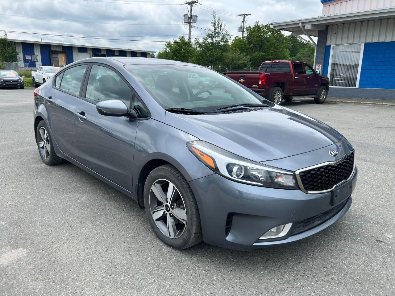 <p>Looking for a reliable and stylish sedan that wont break the bank? Look no further than this 2018 Kia Forte LX, available now at Canadian Auto Sales NL. This sleek blue sedan boasts a comfortable black interior and a peppy 2.0L 4-cylinder engine, making it perfect for navigating city streets or cruising on the open road. With just 76,309km on the odometer, this Forte is ready for many more adventures.</p><p>This well-maintained LX trim offers a wealth of features designed to enhance your driving experience. Enjoy the convenience of automatic headlights and cruise control, stay connected with the AM/FM radio and MP3 player, and keep your passengers comfortable with heated seats. Safety is paramount, with features like anti-lock brakes, stability control, and a rearview camera ensuring peace of mind on every journey.</p><p>Here are five of the most notable features that make this 2018 Kia Forte LX stand out:</p><ul><li><strong>Heated Seats:</strong> Cozy up on chilly mornings with the comfort of heated seats.</li><li><strong>Rearview Camera:</strong> Drive with confidence knowing you have a clear view of whats behind you.</li><li><strong>MP3 Player:</strong> Enjoy your favorite tunes on the go with the built-in MP3 player.</li><li><strong>Stability Control:</strong> Feel secure and in control with advanced stability control technology.</li><li><strong>Heated Mirrors:</strong> No more foggy mornings with the convenience of heated mirrors.</li></ul><p>Dont miss out on this fantastic opportunity to own a reliable and feature-rich Kia Forte LX. Visit Canadian Auto Sales NL today to experience it for yourself!</p>