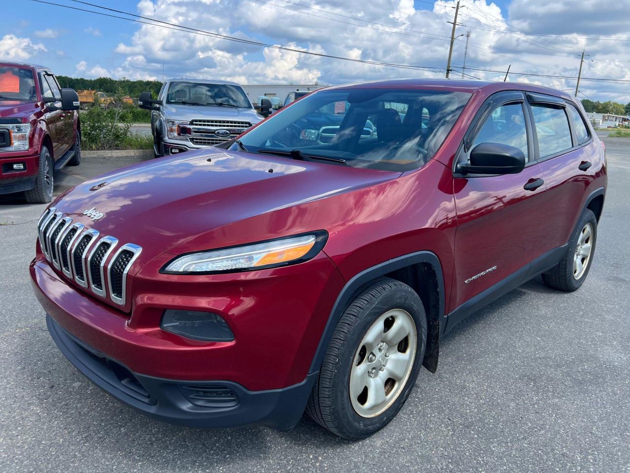 <p>Looking for a reliable and stylish SUV that can handle anything you throw at it? Look no further than this 2015 Jeep Cherokee Sport, available now at Canadian Auto Sales NL! This striking red Cherokee Sport comes equipped with a powerful 2.4L 6-cylinder engine, perfect for conquering Canadian winters and weekend adventures. With its sleek black interior and comfortable seating, youll enjoy every journey, whether its a daily commute or a road trip.</p><p>This well-maintained Cherokee has just 126,964km on the odometer, indicating years of reliable service ahead. It boasts an array of features designed to enhance your driving experience, including air conditioning, Bluetooth connectivity, a rearview camera for added safety, and a tilt steering wheel for personalized comfort.</p><p>Here are 5 of the Cherokee Sports most enticing features:</p><ol><li><strong>Unleash the Power:</strong> This 2.4L 6-cylinder engine ensures smooth and responsive performance, whether youre cruising down the highway or navigating city streets.</li><li><strong>Stay Connected:</strong> Bluetooth connectivity allows you to seamlessly connect your smartphone for hands-free calling and music streaming.</li><li><strong>Drive with Confidence:</strong> The rearview camera provides a clear view of whats behind you, enhancing safety and peace of mind.</li><li><strong>Enjoy the Ride:</strong> Air conditioning keeps you cool and comfortable, no matter the weather.</li><li><strong>Tailor Your Drive:</strong> A tilt steering wheel lets you adjust the wheel to your perfect position for a comfortable and ergonomic driving experience.</li></ol><p>This Jeep Cherokee Sport is a fantastic option for anyone seeking a versatile and well-equipped SUV. Contact Canadian Auto Sales NL today to schedule a test drive and experience it for yourself!</p>