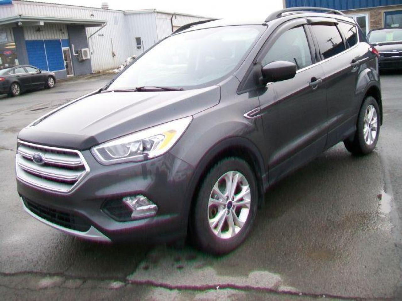 <p>This 2019 Ford Escape SEL ECO BOOST is a stylish and versatile SUV ready to take on your next adventure. With its sleek grey exterior and comfortable black leather interior, this Escape is sure to turn heads. Equipped with a powerful yet fuel-efficient 1.5L 4-cylinder engine and a smooth automatic transmission, this Escape provides a seamless driving experience.</p><p>This Escape is loaded with features to keep you comfortable and entertained on the road. Whether youre enjoying a long road trip or simply running errands around town, this vehicle will make your commute enjoyable. This Escape has a low mileage of 70,377km, meaning its just breaking in and ready for many more miles to come.</p><p>Ready to take this Escape for a test drive? Visit us at Canadian Auto Sales NL today! Well be happy to answer any questions you may have and help you find your perfect ride.</p><p>Here are 5 of the Escapes most enticing features:</p><ol><li><strong>Leather Seats</strong>: Enjoy the comfort and luxury of heated leather seats on those chilly mornings or cool evenings.</li><li><strong>Push Button Start</strong>: Say goodbye to fumbling with keys and experience the convenience of push-button start technology.</li><li><strong>ECO BOOST Engine</strong>: Enjoy the power of a turbocharged engine while still achieving impressive fuel efficiency.</li><li><strong>Rearview Camera</strong>: Navigate parking lots and tight spaces with ease thanks to the included rearview camera.</li><li><strong>Power Everything</strong>: From the windows to the seats and even the trunk, experience the convenience of power-operated features.</li></ol>