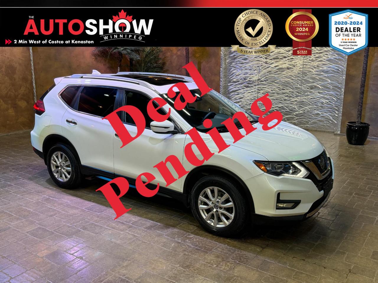 <strong>*** GLACIER WHITE NISSAN ROGUE SV AWD *** SUNROOF, HEATED SEATS, REMOTE START *** 7.0 INCH TOUCH-SCREEN, APPLE CARPLAY, SIRIUSXM!! *** </strong>Introducing the 2020 Nissan Rogue SV AWD- where advanced technology, premium comfort, and dynamic performance come together in a sleek and stylish package. Designed for those who seek versatility and refinement in their daily drive, the Rogue SV AWD is built to elevate every journey, whether its a commute through the city or an adventure on the open road. The 2020 Nissan Rogue SV AWD impresses with its contemporary design, featuring bold lines, a distinctive V-Motion grille, and striking LED daytime running lights. Its aerodynamic shape not only enhances its visual appeal but also improves fuel efficiency, making it an ideal choice for the modern driver. Step inside the Rogue SV AWD, and youll find a spacious and thoughtfully crafted interior with features such as a <b>SUNROOF</b>......<strong>HEATED SEATS</strong>......7.0 Inch Touch-Screen......<strong>APPLE CARPLAY</strong>......<strong>SIRIUSXM</strong>......AM/FM Radio......<strong>NISSAN CONNECT</strong>......Six Speakers......USB A Input......AUX Input......<strong>REMOTE START</strong>......Eco Mode......Sport Mode Shifter......Intelligent All-Wheel-Drive......<strong>NISSAN SAFETY SHIELD 360</strong>......Automatic Emergency Braking w/ Pedestrian Detection......Advanced Drive-Assist Display......<strong>LANE DEPARTURE WARNING</strong>......<strong>BLIND SPOT WARNING</strong>......Rear Automatic Braking......Rear Sonar System......Rear Cross Traffic Alert......Rear Door Alert......Rear View Monitor......Active Ride Control......Intelligent Trace Control......Intelligent Engine Brake......Hill Start Assist......High Beam Assist......<strong>LED DAYTIME RUNNING LIGHTS</strong>......Intelligent Auto Headlights......Sun Visors w/ Illuminated Vanity Mirrors......Four Cargo Tie-Down Hooks......Divide-N-Hide Cargo System......Rear Center Folding Arm Rest w/ Cupholders......<strong>ROOF RAILS</strong>......<strong>MOTION ACTIVATED LIFTGATE</strong>......Rear Privacy Glass......Keyless Entry......Push-Button Engine Ignition......<strong>2.5L I4 </strong>Engine......Automatic Transmission......<strong>17 INCH ALUMINUM ALLOY WHEELS </strong>w/ <strong>TOYO TIRES</strong>!!<br /><br />This vehicle comes with the original Owners Manual and only <strong>112,500 KILOMETERS</strong>!! Financing and Extended Warranty available!!<br /><br /><br />Will accept trades. Please call (204)560-6287 or View at 3165 McGillivray Blvd. (Conveniently located two minutes West from Costco at corner of Kenaston and McGillivray Blvd.)<br /><br />In addition to this please view our complete inventory of used <a href=\https://www.autoshowwinnipeg.com/used-trucks-winnipeg/\>trucks</a>, used <a href=\https://www.autoshowwinnipeg.com/used-cars-winnipeg/\>SUVs</a>, used <a href=\https://www.autoshowwinnipeg.com/used-cars-winnipeg/\>Vans</a>, used <a href=\https://www.autoshowwinnipeg.com/new-used-rvs-winnipeg/\>RVs</a>, and used <a href=\https://www.autoshowwinnipeg.com/used-cars-winnipeg/\>Cars</a> in Winnipeg on our website: <a href=\https://www.autoshowwinnipeg.com/\>WWW.AUTOSHOWWINNIPEG.COM</a><br /><br />Complete comprehensive warranty is available for this vehicle. Please ask for warranty option details. All advertised prices, fees and payments plus taxes (where applicable).<br /><br />Winnipeg, MB - Manitoba Dealer Permit # 5851