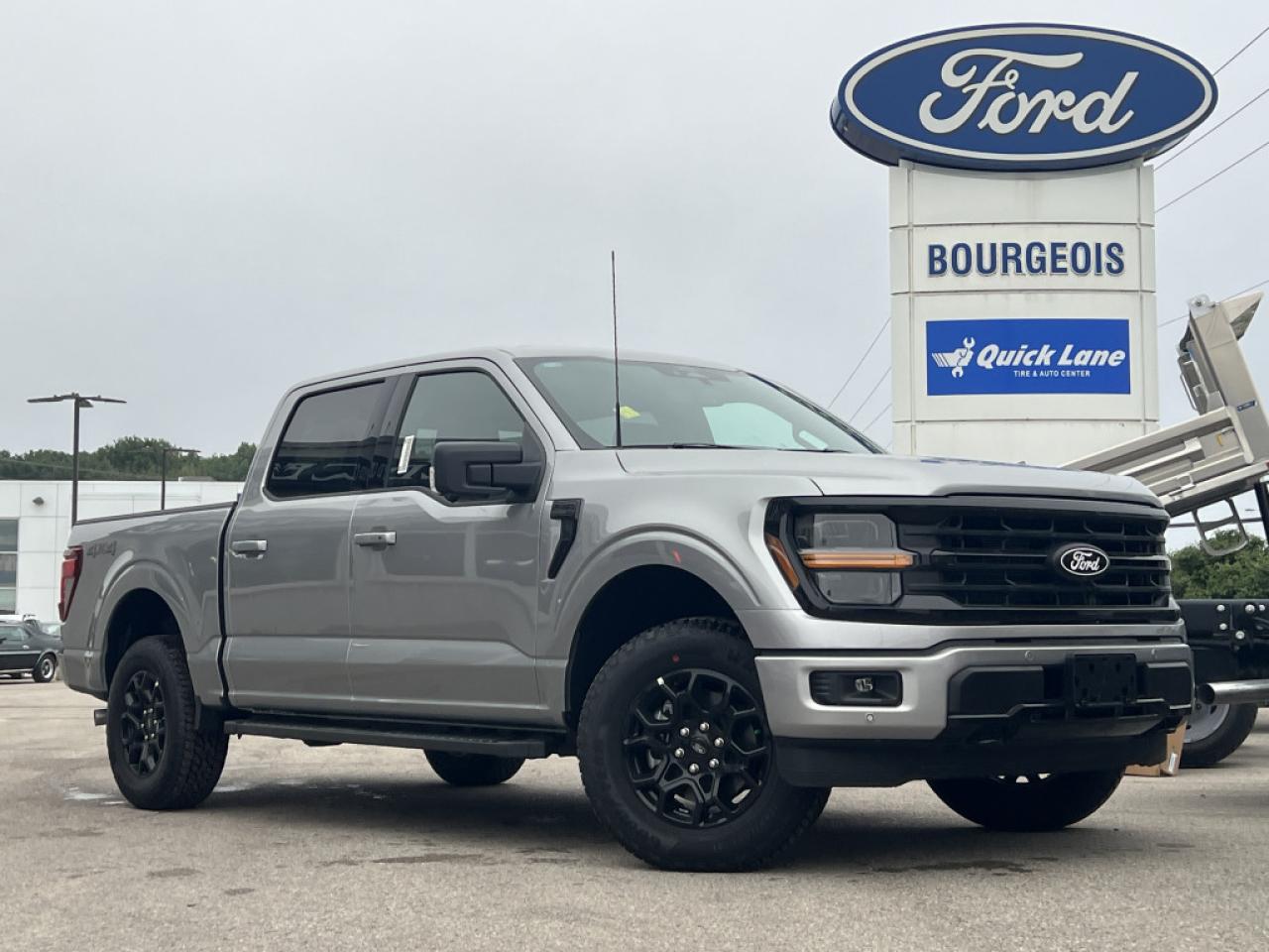 <b>XLT Black Appearance Package, Unique Sport Cloth Bucket Seats!</b><br> <br> <br> <br>  The Ford F-150 is for those who think a day off is just an opportunity to get more done. <br> <br>Just as you mould, strengthen and adapt to fit your lifestyle, the truck you own should do the same. The Ford F-150 puts productivity, practicality and reliability at the forefront, with a host of convenience and tech features as well as rock-solid build quality, ensuring that all of your day-to-day activities are a breeze. Theres one for the working warrior, the long hauler and the fanatic. No matter who you are and what you do with your truck, F-150 doesnt miss.<br> <br> This iconic silver metallic Crew Cab 4X4 pickup   has a 10 speed automatic transmission and is powered by a  325HP 2.7L V6 Cylinder Engine.<br> <br> Our F-150s trim level is XLT. This XLT trim steps things up with running boards, dual-zone climate control and a 360 camera system, along with great standard features such as class IV tow equipment with trailer sway control, remote keyless entry, cargo box lighting, and a 12-inch infotainment screen powered by SYNC 4 featuring voice-activated navigation, SiriusXM satellite radio, Apple CarPlay, Android Auto and FordPass Connect 5G internet hotspot. Safety features also include blind spot detection, lane keep assist with lane departure warning, front and rear collision mitigation and automatic emergency braking. This vehicle has been upgraded with the following features: Xlt Black Appearance Package, Unique Sport Cloth Bucket Seats. <br><br> View the original window sticker for this vehicle with this url <b><a href=http://www.windowsticker.forddirect.com/windowsticker.pdf?vin=1FTEW3LP1RKD84497 target=_blank>http://www.windowsticker.forddirect.com/windowsticker.pdf?vin=1FTEW3LP1RKD84497</a></b>.<br> <br>To apply right now for financing use this link : <a href=https://www.bourgeoismotors.com/credit-application/ target=_blank>https://www.bourgeoismotors.com/credit-application/</a><br><br> <br/> 5.99% financing for 84 months.  Incentives expire 2024-12-02.  See dealer for details. <br> <br>Discount on vehicle represents the Cash Purchase discount applicable and is inclusive of all non-stackable and stackable cash purchase discounts from Ford of Canada and Bourgeois Motors Ford and is offered in lieu of sub-vented lease or finance rates. To get details on current discounts applicable to this and other vehicles in our inventory for Lease and Finance customer, see a member of our team. </br></br>Discover a pressure-free buying experience at Bourgeois Motors Ford in Midland, Ontario, where integrity and family values drive our 78-year legacy. As a trusted, family-owned and operated dealership, we prioritize your comfort and satisfaction above all else. Our no pressure showroom is lead by a team who is passionate about understanding your needs and preferences. Located on the shores of Georgian Bay, our dealership offers more than just vehiclesits an experience rooted in community, trust and transparency. Trust us to provide personalized service, a diverse range of quality new Ford vehicles, and a seamless journey to finding your perfect car. Join our family at Bourgeois Motors Ford and let us redefine the way you shop for your next vehicle.<br> Come by and check out our fleet of 70+ used cars and trucks and 170+ new cars and trucks for sale in Midland.  o~o