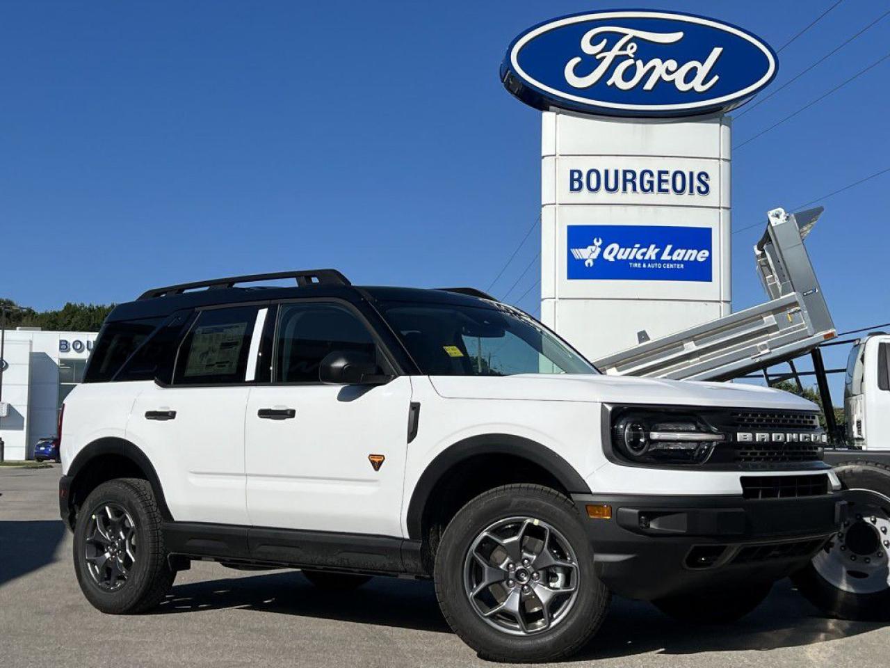 <p>Discover the path less traveled with the new Ford Bronco Sport Badlands 4x4, dressed in a striking white exterior and a unique blue interior, designed for unparalleled off-road adventures and comfortable city driving alike. This 4x4 powerhouse, equipped with a robust 2.0L 4-cyl engine, provides a thrilling experience with every turn, boasting a seamless automatic transmission and just 170 km on the clock, ensuring it's primed for exploration.</p><p>The Bronco Sport Badlands doesn't just excel in performance; it captivates with its rugged yet refined exterior styling and a cabin filled with luxury and state-of-the-art features. Inside, passengers are greeted by comfortable heated seats, wrapped in durable materials, and a leatherette steering wheel, creating an inviting atmosphere for all journeys, short or long. Its spacious interior is matched by practicality and versatility, making it the perfect companion for any adventure.</p><p>Technology enthusiasts will revel in the Bronco Sport Badlands' cutting-edge offerings, including a backup camera for easy parking, bluetooth connection for seamless smartphone integration, and satellite radio to keep you entertained no matter where the road takes you. The inclusion of advanced safety features like lane assist and brake assist, along with the convenience of remote start, keyless entry, and smart device integration, ensures every drive is not only thrilling but safe and comfortable.</p><p>Geared towards the adventurous spirit who craves both the adrenaline of off-road escapades and the sophistication of urban driving, this Ford Bronco Sport Badlands 4x4 is waiting for its next owner. Don't miss your chance to own this versatile SUV. We invite you to contact the dealership today for more information and to schedule your test drive. The road less traveled is calling.</p> <p><span style=color:rgb( 58 , 80 , 95 )>The discount shown on vehicle represents the </span><u>Cash Purchase</u><span style=color:rgb( 58 , 80 , 95 )> discount and is inclusive of all non-stackable and stackable cash purchase discounts from Ford of Canada and Bourgeois Ford North and is offered in lieu of sub-vented lease or finance rates. To get details on current discounts applicable to this and other vehicles in our inventory for Lease and Finance customer, see a member of our team. All offers for lease or finance are On Approved Credit (OAC).While every effort is made to ensure the accuracy of discounts and programs, programs are subject to change without notice </span><span style=color:rgb( 119 , 119 , 119 )>and may not be accurate or completely current. While every reasonable effort is made to ensure the accuracy of this data, we are not responsible for any errors or omissions contained on these pages.</span></p> <p><strong>Financing Your Next Vehicle with Bourgeois Motors Ford in Midland:</strong></p><p>At Bourgeois Motors Ford, we make financing your next vehicle simple and stress-free! Our team works with trusted lenders to find flexible options tailored to your budget. Drive away with confidenceapply today!</p><p>Take advantage of our online pre-qualification tool, backed by Equifax and TD Bank to find the payment that works for you. Simply <a href=https://www.bourgeoismotors.com/free-credit-check/ rel=nofollow><strong>CLICK HERE</strong></a><strong> </strong>to use our secure online credit tool with no impact to your credit.</p>