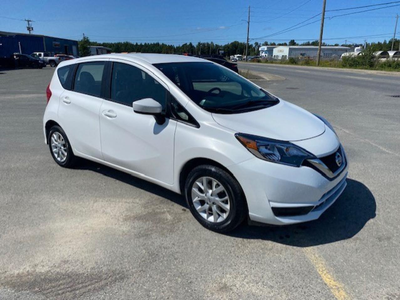 <p>Looking for a reliable and practical hatchback that wont break the bank? Look no further than this 2018 Nissan Versa Note SV FWD, available now at Canadian Auto Sales NL. With its sleek white exterior and comfortable dark grey interior, this Versa Note is sure to turn heads wherever you go. Equipped with a peppy 4-cylinder engine and a smooth automatic transmission, this car is perfect for navigating city streets or hitting the open road. It also boasts a spacious interior that comfortably accommodates both passengers and cargo, thanks to its clever pass-through rear seat. With only 73,906 km on the odometer, this Versa Note is just getting started.</p><p>This Versa Note is packed with features that enhance your driving experience, keeping you safe, comfortable, and entertained. Enjoy the convenience of power steering, power mirrors, and steering wheel audio controls. Stay connected with the AM/FM radio and auxiliary audio input. And feel confident behind the wheel with features like anti-lock brakes, stability control, and traction control.</p><p>Five features to make you say Wow!:</p><ul><li><strong>Heated Mirrors</strong>: Keep your vision clear even on the coldest winter days.</li><li><strong>Pass-Through Rear Seat</strong>: Transform your Versa Note from a passenger car to a cargo hauler with ease.</li><li><strong>Side Air Bags</strong>: An extra layer of safety for you and your passengers.</li><li><strong>Power Mirrors</strong>: Adjust your mirrors with the touch of a button for added convenience.</li><li><strong>Steering Wheel Audio Controls</strong>: Keep your hands on the wheel and your eyes on the road while controlling your music.</li></ul><p>Come down to Canadian Auto Sales NL today and experience this impressive Versa Note for yourself!</p>