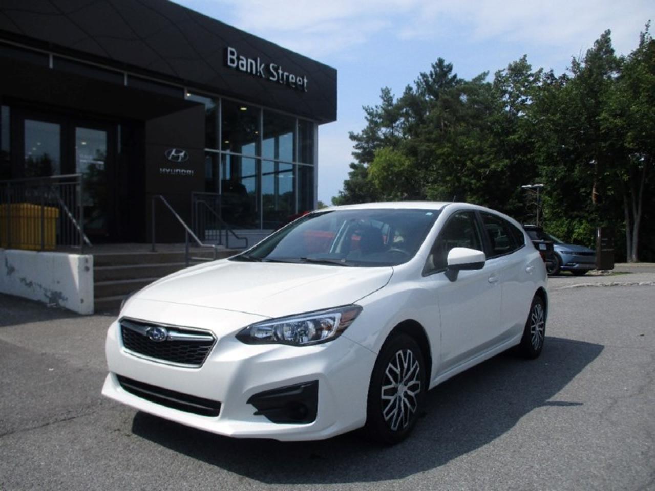 The 2019 Subaru Impreza Convenience is the base trim of Subarus compact car, available in both sedan and hatchback body styles. It is known for its affordability, practicality, and standard all-wheel drive (AWD), which is a unique offering in the compact car segment. The 2019 Impreza Convenience is powered by a 2.0-liter 4-cylinder BOXER engine that produces 152 horsepower and 145 lb-ft of torque. This engine is paired with either a 5-speed manual transmission or an optional continuously variable transmission (CVT).Subarus EyeSight Driver Assist Technology, which includes features like adaptive cruise control, pre-collision braking, and lane departure warning, is available as an option.The Convenience trim features cloth upholstery, a 6.5-inch touchscreen infotainment system with Apple CarPlay and Android Auto compatibility, Bluetooth connectivity, and a rearview camera.Overall, the 2019 Subaru Impreza Convenience is an excellent choice for those seeking a reliable, safe, and all-weather capable compact car at an affordable price point.