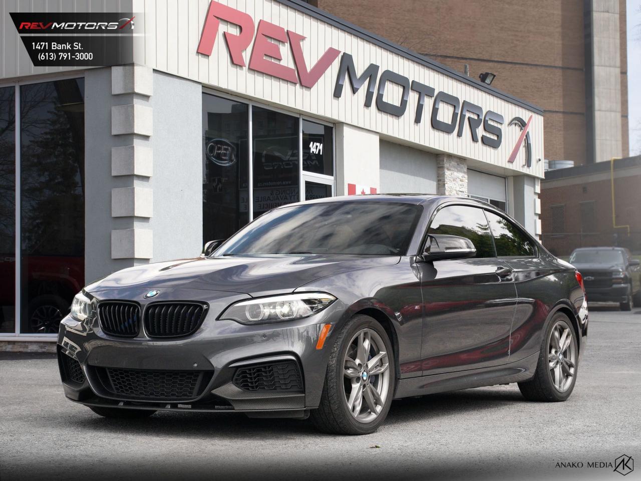 2018 BMW M240i xDrive | Sunroof | Heated Seats | Bluetooth | Leather<br/>  <br/> Grey Exterior | Black Leather Interior | Alloy Wheels | Keyless Entry | Front Power Seats | Sunroof | Drive Mode Select | Traction Control | Parking Aid | Voice Control | Bluetooth Connection | Cruise Control | Navigation | Front Heated Seats | Rearview Camera | Push Button Start | Ambient Lighting and much more. <br/> <br/>  <br/> Key Features: <br/> <br/>  <br/> Powerful Performance: Equipped with a 3.0L inline-6 turbocharged engine, delivering an impressive 335 horsepower and 369 lb-ft of torque. Experience thrilling acceleration and dynamic handling on every drive. <br/> <br/>  <br/> Rear-Wheel Drive: BMWs rear-wheel-drive system ensures optimal traction and stability, providing confidence in all driving conditions. <br/> <br/>  <br/> Luxurious Interior: Enjoy premium leather seats, a driver-oriented cockpit, and high-quality materials throughout. The interior is designed for maximum comfort and convenience. <br/> <br/>  <br/> Advanced Technology: Stay connected and entertained with the iDrive infotainment system, featuring navigation, Bluetooth connectivity, and a premium sound system. The vehicle also includes a sunroof, adding to the luxurious feel. <br/> <br/>  <br/> Safety First: Equipped with advanced safety features, including multiple airbags, stability control, anti-lock brakes, and a suite of driver assistance systems, ensuring peace of mind for you and your passengers. <br/> <br/>  <br/> This vehicle has travelled 104,092 kms. <br/> <br/>  <br/> *** NO additional fees except for taxes and licensing! *** <br/> <br/>  <br/> *** 100-point inspection on all our vehicles & always detailed inside and out *** <br/> <br/>  <br/> RevMotors is at your service to ensure you find the right car for YOU. Even if we do not have it in our inventory, we are more than happy to find you the vehicle that you are looking for. Give us a call at 613-791-3000 or visit us online at www.revmotors.ca <br/> <br/>  <br/> a nous donnera du plaisir de vous servir en Franais aussi! <br/> <br/>  <br/> CERTIFICATION * All our vehicles are sold Certified and E-Tested for the province of Ontario (Quebec Safety Available, additional charges may apply) <br/> FINANCING AVAILABLE * RevMotors offers competitive finance rates through many of the major banks. Should you feel like youve had credit issues in the past, we have various financing solutions to get you on the road.  We accept No Credit - New Credit - Bad Credit - Bankruptcy - Students and more!! <br/> EXTENDED WARRANTY * For your peace of mind, if one of our used vehicles is no longer covered under the manufacturers warranty, RevMotors will provide you with a 6 month / 6000KMS Limited Powertrain Warranty. You always have the options to upgrade to more comprehensive coverage as well. Well be more than happy to review the options and chose the coverage thats right for you! <br/> TRADES * Do you have a Trade-in? We offer competitive trade in offers for your current vehicle! <br/> SHIPPING * We can ship anywhere across Canada. Give us a call for a quote and we will be happy to help! <br/> <br/>  <br/> Buy with confidence knowing that we always have your best interests in mind! <br/>