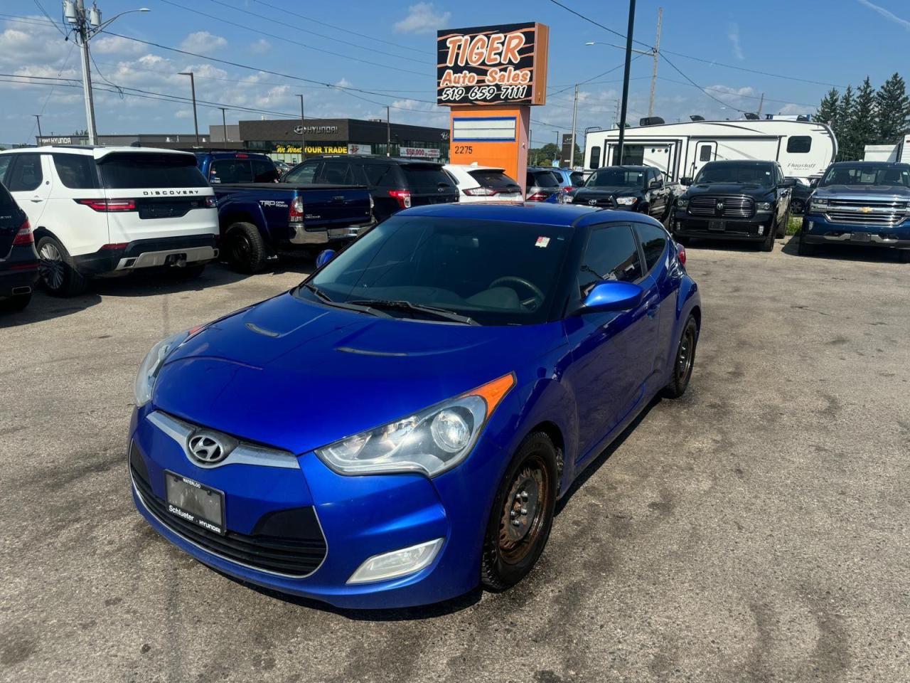 <p>Looking for a stylish and fuel-efficient coupe thats packed with features? Look no further than this 2012 Hyundai Veloster, available now at Tiger Auto Sales Ltd.! This certified pre-owned vehicle is sure to turn heads with its sleek blue exterior and comfortable grey interior. With its peppy 4-cylinder engine and automatic transmission, this Veloster offers a smooth and enjoyable driving experience. And dont worry about those long commutes, as this car is known for its impressive fuel economy.</p><p>This Veloster comes equipped with a full suite of features designed to keep you safe and comfortable on the road. Enjoy the convenience of keyless entry, power windows, and heated mirrors, all while cruising with the peace of mind of anti-lock brakes, traction control, and multiple airbags. Whether youre running errands or hitting the open road, this Hyundai Veloster is ready to take you there in style.</p><p>With a total of 249,340 km on the odometer, this car has plenty of life left in it. Stop by Tiger Auto Sales Ltd. today to take this certified pre-owned Hyundai Veloster for a test drive!</p><p><strong>Here are five of the Velosters most sizzling features:</strong></p><ol><li><strong>Certified Pre-Owned:</strong> This ensures peace of mind with a comprehensive inspection and warranty.</li><li><strong>Great on Fuel:</strong> Save money at the pump with this fuel-efficient coupe.</li><li><strong>Keyless Entry:</strong> Unlock your car with the push of a button, for added convenience.</li><li><strong>Heated Mirrors:</strong> Enjoy clear visibility even on cold winter mornings.</li><li><strong>Warranty Included:</strong> Drive with confidence knowing that your investment is protected.</li></ol>