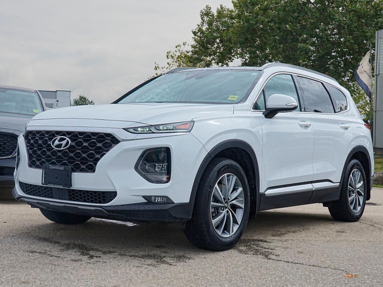 Experience Ultimate Comfort and Power with the Pre-Owned 2020 Hyundai Santa Fe Preferred 2.0T Preferred AWD!Get behind the wheel of the stylish and capable 2020 Hyundai Santa Fe Preferred 2.0T Preferred AWD. This pre-owned vehicle is packed with features that will elevate your driving experience to new heights. Heres why this Santa Fe is the perfect choice for you:Unforgettable Style: The sleek white exterior of this Santa Fe is sure to turn heads wherever you go. With its rear spoiler, fog lamps, and automatic headlights, youll make a bold statement on the road.Luxurious Comfort: Slip into the premium leather seats and enjoy the warmth of the heated front seats and heated steering wheel. The leather steering wheel and woodgrain interior trim add a touch of sophistication to your drive. Plus, the power driver seat with driver adjustable lumbar ensures you find the perfect seating position for ultimate comfort.Advanced Safety: Drive with confidence knowing that this Santa Fe is equipped with advanced safety features such as blind spot monitor, rear parking aid, rear collision mitigation, front collision mitigation, lane keeping assist, adaptive cruise control, and automatic high beams. Your safety is always a top priority.Smart Technology: Stay connected on the go with the integrated telematics, Bluetooth connection, and smart device integration. The HD radio, satellite radio, and MP3 capability provide endless entertainment options.Convenience at Your Fingertips: Enjoy the convenience of keyless entry, keyless start, and remote engine start, making your daily routine even more effortless. The universal garage door opener and auto-dimming rearview mirror add extra convenience to your drive.Powerful Performance: The turbocharged 4-cylinder engine and all-wheel drive give you the power and control you need, while the 8-speed automatic transmission with dual-shift mode ensures smooth and responsive gear changes.With its versatile features, advanced safety technologies, and luxurious comfort, the 2020 Hyundai Santa Fe Preferred 2.0T Preferred AWD is the perfect pre-owned vehicle for those who crave style, performance, and convenience. Dont miss out on this incredible opportunity. Visit our dealership today and take this Santa Fe for a test drive!