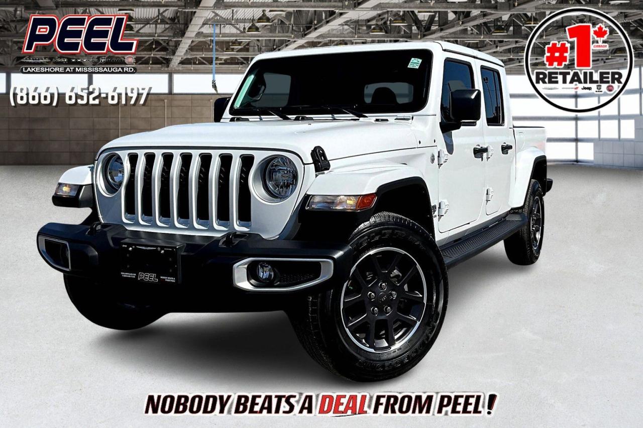 COME SEE WHY NOBODY BEATS A DEAL FROM PEEL! Your Source for ALL make and models used cars and trucks. Canadas #1 Stellantis Retailer for 8 years & counting!!

2022 Jeep Gladiator Overland 4X4 | 3.6L V6 | Bright White | Heated Leather Bucket Seats | Uconnect 8.4" Touchscreen w/ Navigation | Trailer Tow Package | Body-colour Hard Top & Fenders | Heated Steering Wheel | Remote Start | Apple CarPlay & Android Auto | Bluetooth | Class IV Hitch Receiver | Mopar Black Side Steps 

One Owner Clean Carfax

Adventure meets luxury in this 2022 Jeep Gladiator Overland 4X4, a perfect combination of rugged capability and refined comfort. Powered by a 3.6L V6 engine, this Gladiator is ready for any terrain, while its Bright White exterior, body-colour hard top and fenders, and Mopar black side steps ensure it looks as good as it performs. Inside, youll find heated leather bucket seats and a heated steering wheel, making every drive a pleasure, no matter the season. The Uconnect 8.4" touchscreen with navigation, Apple CarPlay, Android Auto, and Bluetooth keeps you connected on the go, while remote start adds convenience. With the Trailer Tow Package, Class IV hitch receiver, and Jeeps legendary off-road prowess, this Gladiator is built to handle both work and play with ease. Plus, with just one owner and a clean Carfax, you can drive confidently knowing this vehicle is in pristine condition. Dont miss out on this blend of rugged versatility and premium features!
______________________________________________________

Engage & Explore with Peel Chrysler: Whether youre inquiring about our latest offers or seeking guidance, 1-866-652-6197 connects you directly. Dive deeper online or connect with our team to navigate your automotive journey seamlessly.

WE TAKE ALL TRADES & CREDIT. WE SHIP ANYWHERE IN CANADA! OUR TEAM IS READY TO SERVE YOU 7 DAYS!
______________________________________________________

*FREE CarFax (click the link above to check it out at no cost to you!)*

*FULLY CERTIFIED! (Have you seen some of these other dealers stating in their advertisements that certification is an additional fee? NOT HERE! Our certification is already included in our low sale prices to save you more!)

______________________________________________________

Peel Chrysler  A Trusted Destination: Based in Port Credit, Ontario, we proudly serve customers from all corners of Ontario and Canada including Toronto, Oakville, North York, Richmond Hill, Ajax, Hamilton, Niagara Falls, Brampton, Thornhill, Scarborough, Vaughan, London, Windsor, Cambridge, Kitchener, Waterloo, Brantford, Sarnia, Pickering, Huntsville, Milton, Woodbridge, Maple, Aurora, Newmarket, Orangeville, Georgetown, Stouffville, Markham, North Bay, Sudbury, Barrie, Sault Ste. Marie, Parry Sound, Bracebridge, Gravenhurst, Oshawa, Ajax, Kingston, Innisfil and surrounding areas. On our website www.peelchrysler.com, you will find a vast selection of new vehicles including the new and used Ram 1500, 2500 and 3500. Chrysler Grand Caravan, Chrysler Pacifica, Jeep Cherokee, Wrangler and more. All vehicles are priced to sell. We deliver throughout Canada. website or call us 1-866-652-6197. 

Your Journey, Our Commitment: Beyond the transaction, Peel Chrysler prioritizes your satisfaction. While many of our pre-owned vehicles come equipped with two keys, variations might occur based on trade-ins. Regardless, our commitment to quality and service remains steadfast. Experience unmatched convenience with our nationwide delivery options. All advertised prices are for cash sale only. Optional Finance and Lease terms are available. A Loan Processing Fee of $499 may apply to facilitate selected Finance or Lease options. If opting to trade an encumbered vehicle towards a purchase and require Peel Chrysler to facilitate a lien payout on your behalf, a Lien Payout Fee of $299 may apply. Contact us for details. Peel Chrysler Pre-Owned Vehicles come standard with only one key.