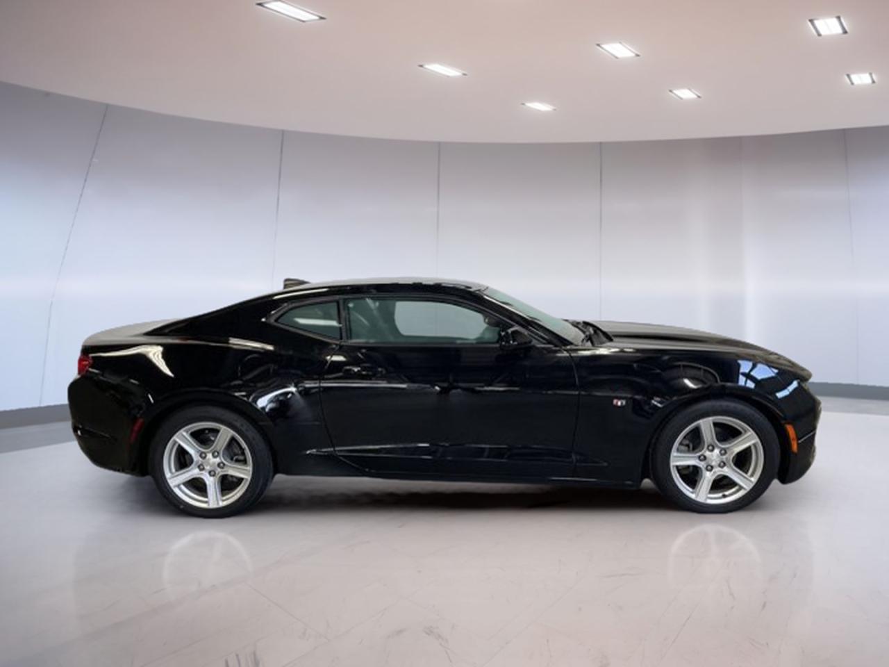 <p> this Camaro offers a dynamic driving experience with its automatic transmission and propulsion traction.

FEATURES OF THE Camaro 1lt - Local Trade
»» Convertible design for open-air enjoyment
»» Automatic transmission for effortless driving
»» Stylish black exterior with grey interior
»» 50</p>
<p>153 km indicating moderate use

ADVANCED SAFETY FEATURES
»» Rearview camera for easy parking
»» Stability control for safer handling
»» Traction control for enhanced grip
»» Anti-lock braking system for improved safety

PERFORMANCE AND EFFICIENCY
»» Propulsion traction for thrilling drives
»» Efficient fuel consumption for longer journeys
»» Responsive automatic transmission
»» Powerful engine for exhilarating performance

COMFORT AND CONVENIENCE
»» Dual-zone climate control for personalized comfort
»» Power-adjustable seats for tailored seating
»» Keyless entry for quick access
»» Ample legroom for passenger comfort

TECHNOLOGY AND CONNECTIVITY
»» Bluetooth connectivity for hands-free calls
»» Infotainment system with touchscreen display
»» USB ports for device charging
»» Premium sound system for quality audio

CARGO SPACE
»» Sufficient trunk space for essentials
»» Foldable rear seats for extra room
»» Convenient storage compartments
»» Easy access to cargo area

WHAT OTHER OWNERS LIKE
»» Smooth and responsive driving experience
»» Eye-catching convertible design
»» Advanced safety features
»» Comfortable and spacious interior

This 2019 Chevrolet Camaro 1lt - Local Trades VIN is: 1G1FA1RXXK0104424.</p>
<a href=http://www.velocityford.ca/used/Chevrolet-Camaro-2019-id11223587.html>http://www.velocityford.ca/used/Chevrolet-Camaro-2019-id11223587.html</a>