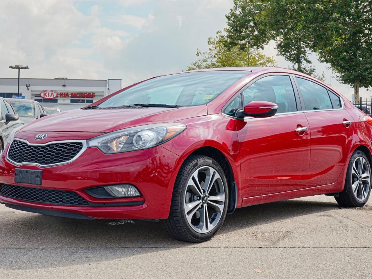 Step into the drivers seat of the exceptional pre-owned 2014 Kia Forte EX 4dr Sdn Auto EX. This stylish sedan delivers a combination of reliability, comfort, and cutting-edge features that make it the perfect choice for your daily commute or weekend adventures. Heres why this Forte is worth your attention:Sleek Design: The striking red exterior paired with the elegant black interior will turn heads wherever you go. Stand out from the crowd with style and sophistication.Efficient Performance: Powered by a fuel-efficient 4-cylinder engine and equipped with front-wheel drive, the Forte EX provides a smooth and responsive driving experience. Enjoy the convenience of a 6-speed automatic transmission for effortless shifting.Safety First: Drive with peace of mind knowing this Forte is equipped with essential safety features such as ABS, traction control, stability control, and 4-wheel disc brakes. The integrated turn signal mirrors and rearview camera provide added visibility for safer maneuvering and parking.Comfortable Interior: Slip into the supportive cloth seats and enjoy the convenience of power windows, power door locks, and cruise control. The spacious pass-through rear seat ensures your passengers can relax and stretch out.Modern Technology: Stay connected on the go with Bluetooth connection, satellite radio, and auxiliary audio input. The integrated CD player, AM/FM stereo, and MP3 player let you enjoy your favorite tunes wherever you roam. The convenient steering wheel audio controls keep your entertainment at your fingertips.Convenience and Versatility: With features like keyless entry, remote trunk release, and universal garage door opener, the Forte EX makes life on the move simpler. The power-folding mirrors and rear defrost add ease to your daily routine.Feel the difference of driving a pre-owned 2014 Kia Forte EX 4dr Sdn Auto EX. Dont miss out on this fantastic opportunity to upgrade your driving experience with a reliable and feature-packed sedan. Contact us today to schedule a test drive and discover why the Kia Forte EX is the perfect fit for you!