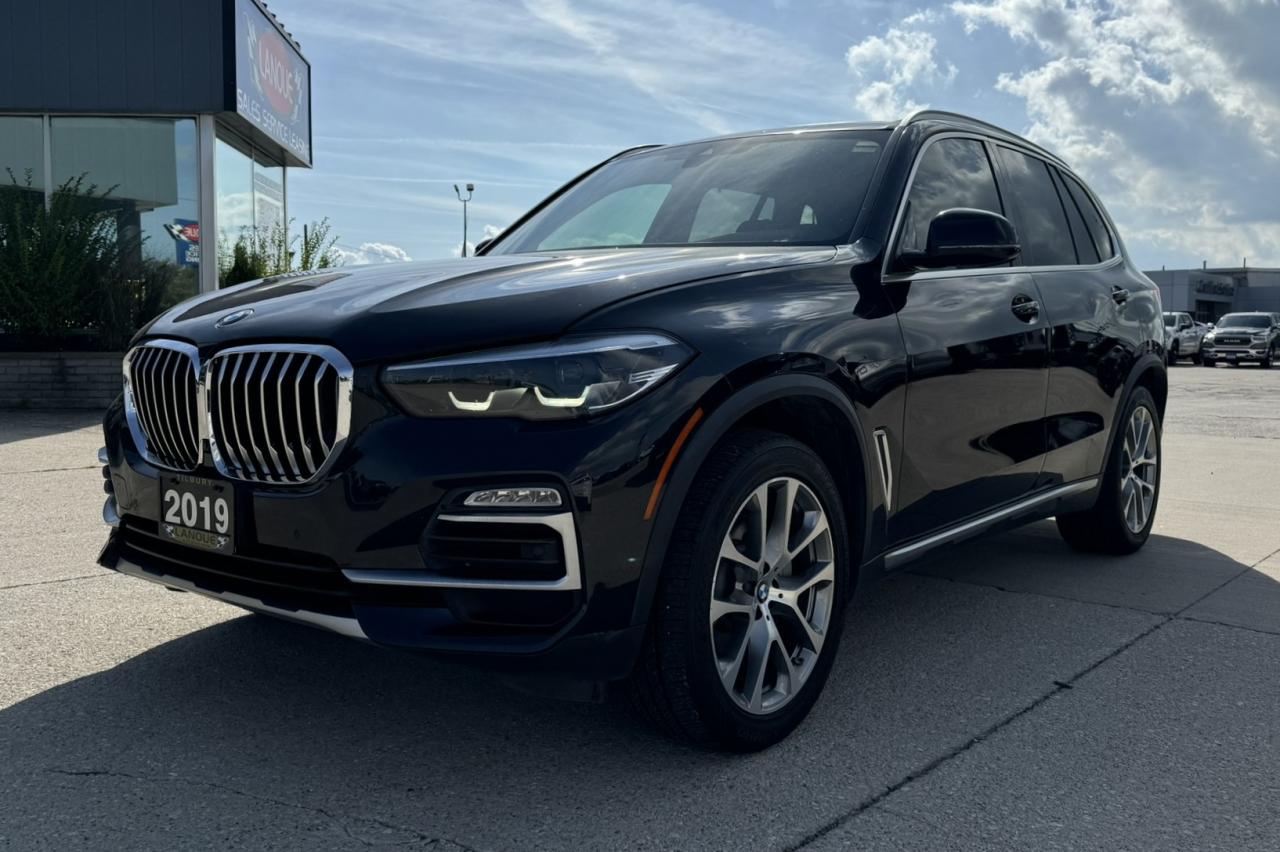 <p style=text-align: center;><strong><span style=font-size: 18pt;>2019 BMW X5 XDRIVE40I</span></strong></p><p style=text-align: center;><strong><span style=font-size: 18pt;>TWINPOWER TURBO 6-CYLINDER ENGINE</span></strong></p><p style=text-align: center;><span style=font-size: 14pt;>335 HORSEPOWER | 330 LB-FT OF TORQUE</span></p><p style=text-align: center;><span style=font-size: 14pt;>9L/100KM HIGHWAY | 11.8L/100KM CITY | 10.7L/100KM COMBINED</span></p><p style=text-align: center;><strong><span style=font-size: 18pt;>8-SPEED STEPTRONIC AUTOMATIC TRANSMISSION</span></strong></p><p style=text-align: center;><strong><span style=font-size: 18pt;>20 LIGHT ALLOY V-SPOKE WHEELS</span></strong></p><p style=text-align: center;> </p><p style=text-align: center;><strong><span style=font-size: 14pt;>STANDARD FEATURES</span></strong></p><p style=text-align: center;><span style=font-size: 14pt;>LED headlights, BMW Live Cockpit, Professional Sport leather steering wheel, Sport seats for driver and front passenger, Steptronic transmission, Adaptive suspension, Rear seat backrest with 40:20:40 division, Ambient light including dynamic interior light</span></p><p style=text-align: center;><span style=font-size: 14pt;>BMW kidney grille with exclusively designed vertical slats with front sides in aluminum with satinised look, grille frame in Pearl, BMW Individual Exterior Line aluminum with satinised look, Air Breather in Pearl Chrome with surround in aluminum, Specific grilles in the front lateral air inlets in black high-gloss, Exclusive water-catching strip in the A-pillar in black high-gloss, Side skirts trim with trim strip in aluminum with satinised look, Sump guard front and rear in stainless steel styling, Active air stream kidney grille with accent bar in Aluminum with satinised look, Tailpipe trims in aluminum with satinised look, BMW Individual roof rails - aluminum with satinised look, Door sill finishers in aluminum with BMW xLine lettering, Car key with chrome clasp</span></p><p style=text-align: center;> </p><p style=text-align: center;> </p><p style=text-align: center;><strong><span style=font-size: 14pt;>M SPORT PACKAGE</span></strong></p><p style=text-align: center;><span style=font-size: 14pt;>M Aerodynamics package with front apron, side skirts and wheel arch trims in body colour, LED fog lights, M Bicolor with runflat tyres, Adaptive M suspension, M Sport Exhaust, Steptronic Sport transmission, BMW Individual Exterior Line Aluminum satinised, M designation on the sides, M sport brakes, Rear apron with diffuser insert, Tailpipe finishers in M Sport package-specific geometry, Exclusive paintwork in Carbon Black metallic, Individual roof rails</span></p><p style=text-align: center;><span style=font-size: 14pt;>M door sill finishers, illuminated, M footrest and M-specific pedals Sport seats for the driver and front passenger in Black Vernasca leather with contrast stitching, M Leather steering wheel, BMW Individual headliner in anthracite, Interior trim finishers in Aluminum Tetragon, Instrument cluster with M specific display in SPORT and SPORT+ mode, M Sport package-specific car key, M-specific floor mats in velour</span></p><p style=text-align: center;> </p><p style=text-align: center;><strong><span style=font-size: 14pt;>SAFETY AND DRIVER ASSISTANCE PACKAGE:</span></strong><br /><span style=font-size: 14pt;>Camera-based systems for front collision warning with braking function, Speed Limit Assist, includes Speed Limit Info with No-overtaking indicator with preview and Lane Departure Warning, Radar-based equipment includes Crossing traffic warning in rear, Lane Change Warning, and Rear collision warning</span></p><p style=text-align: center;> </p><p style=text-align: center;><strong><span style=font-size: 14pt;>ADDITIONAL OPTIONS:</span></strong></p><p style=text-align: center;><span style=font-size: 14pt;>Panorama glass roof, Aluminum roof rails, Soft close doors, Wireless charger, 4-zone automatic air conditioning, Apple Carplay, Roller sunblind window shades in rear, Gestures for audio control on infotainment screen, Front and rear heated seats, Heated steering wheel, Heated and cooled front cupholders, Heads up display</span></p><p style=text-align: center;> </p><p style=text-align: center;> </p><p style=text-align: center;> </p><p style=box-sizing: border-box; margin-bottom: 1rem; margin-top: 0px; color: #212529; font-family: -apple-system, BlinkMacSystemFont, Segoe UI, Roboto, Helvetica Neue, Arial, Noto Sans, Liberation Sans, sans-serif, Apple Color Emoji, Segoe UI Emoji, Segoe UI Symbol, Noto Color Emoji; font-size: 16px; background-color: #ffffff; text-align: center; line-height: 1;><span style=box-sizing: border-box; font-family: arial, helvetica, sans-serif;><span style=box-sizing: border-box; font-weight: bolder;><span style=box-sizing: border-box; font-size: 14pt;>Here at Lanoue/Amfar Sales, Service & Leasing in Tilbury, we take pride in providing the public with a wide variety of High-Quality Pre-owned Vehicles. We recondition and certify our vehicles to a level of excellence that exceeds the Status Quo. We treat our Customers like family and provide the highest level of service from Start to Finish. If you’d like a smooth & stress-free car shopping experience, give one of our Sales Associates a call at 1-844-682-3325 to help you find your next NEW-TO-YOU vehicle!</span></span></span></p><p style=box-sizing: border-box; margin-bottom: 1rem; margin-top: 0px; color: #212529; font-family: -apple-system, BlinkMacSystemFont, Segoe UI, Roboto, Helvetica Neue, Arial, Noto Sans, Liberation Sans, sans-serif, Apple Color Emoji, Segoe UI Emoji, Segoe UI Symbol, Noto Color Emoji; font-size: 16px; background-color: #ffffff; text-align: center; line-height: 1;><span style=box-sizing: border-box; font-family: arial, helvetica, sans-serif;><span style=box-sizing: border-box; font-weight: bolder;><span style=box-sizing: border-box; font-size: 14pt;>Although we try to take great care in being accurate with the information in this listing, from time to time, errors occur. The vehicle is priced as it is physically equipped. Minor variances will not effect pricing. Please verify the vehicle is As Expected when you visit. Thank You!</span></span></span></p>