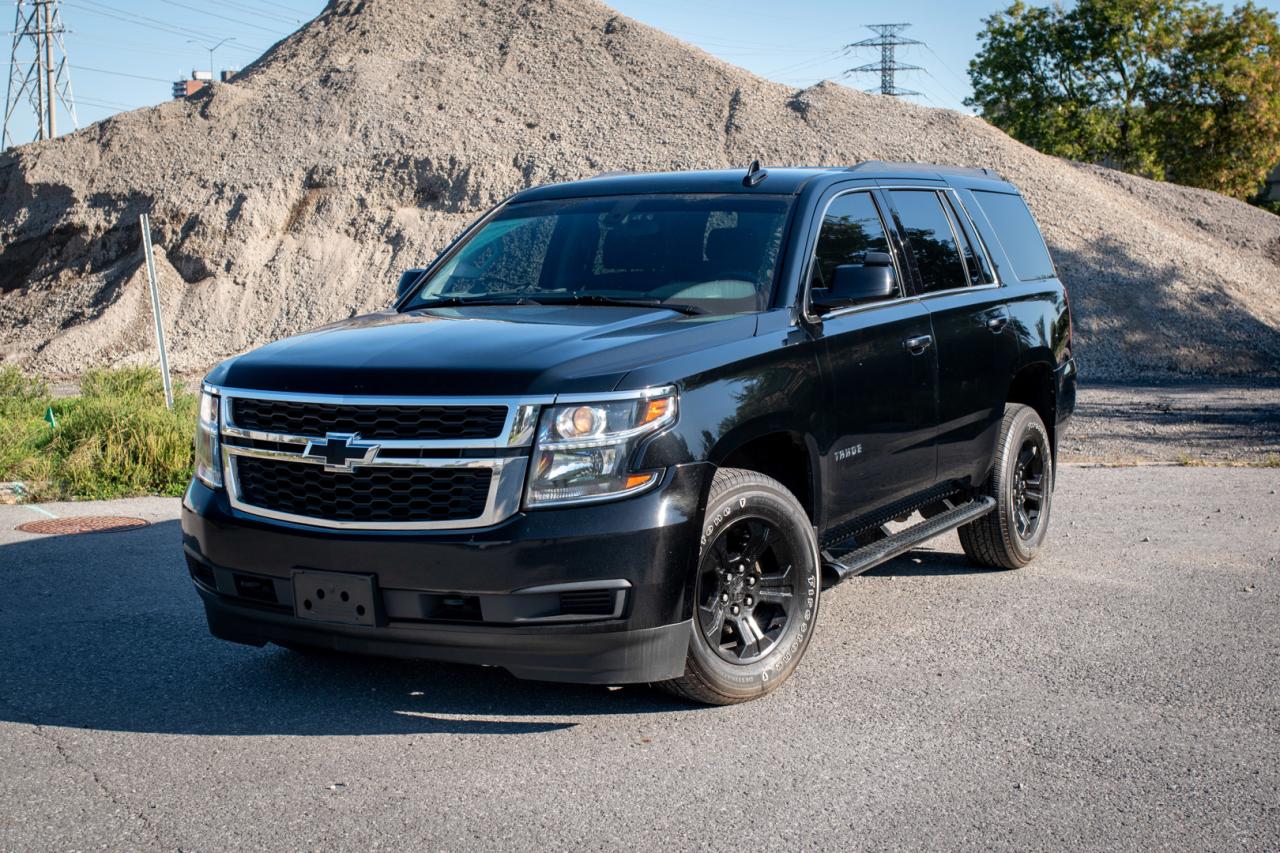 <div>Introducing the 2020 Chevrolet Tahoe LSa full-sized SUV thats all about big space, big features, and big adventures. With 18 MPG, it balances power and efficiency, so youre ready for everything from family road trips to daily errands.</div><br /><div>This Tahoes AWD system, combined with a trailer hitch, makes towing and tackling tough terrains a breeze. Inside, the massive rear trunk space and the generous middle console under the armrest give you all the storage you could need.</div><br /><div>Comfort is key with dual-zone climate control and independent climate settings for the rear passengers, ensuring everyones happy, no matter where theyre sitting. Heated seats keep things cozy up front, and hands-free Bluetooth keeps you connected and focused on the road.</div><br /><div>Parking this beast? No problem. The reverse cam and parking sensors make it easy to navigate tight spots, while cruise control keeps those long drives smooth and stress-free.</div><br /><div>Ready to elevate your driving experience? Book a test drive today and see why the 2020 Chevrolet Tahoe LS is the perfect combination of space, power, and comfort.</div>