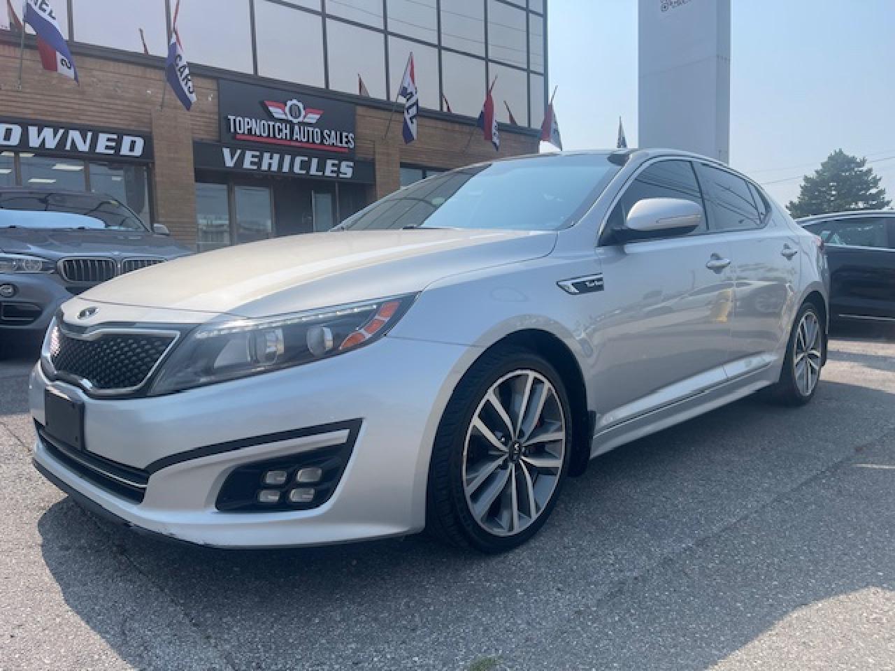 Gorgeous, Very well maintained, FULLY  LOADED 2015 KIA OPTIMA SX TURBO >>> Metallic Silver on Black >>> This beauty comes with all available options including >>> NAVIAGTION >>> PANORAMIC SUNROOF >>> KEY-LESS ENTRY >>> LEATHER HEATED SEAT >>> REARVIEW CAMERA >>>>  PADDLE SHIFTS >>>> UVO integrated display screen >>>>>  selectable drive modes >>> 18-inch alloy wheels, >>> Xenon Headlights>> <br><br>****  FULL SERVICE RECORDS WITH KIA ****<br><br>**** ACCIDENT FREE >>> CARFAX CLEAN **** <br><br>Topnotch Auto Sale is a well established dealer, being in business for well over 14 years. We pride ourselves on how we maintain relationships with our clients, making customer service our first priority. We always aim to keep our large indoor showroom stocked with a diverse inventory, containing the right car for any type of customer. If financing is needed, we provide on the spot financing on all makes and vehicle models. We welcome you to give us a call, take a look online, or come to our establishment at 5161 Steeles Avenue West to take a look at what we have. Looking forward to seeing you !