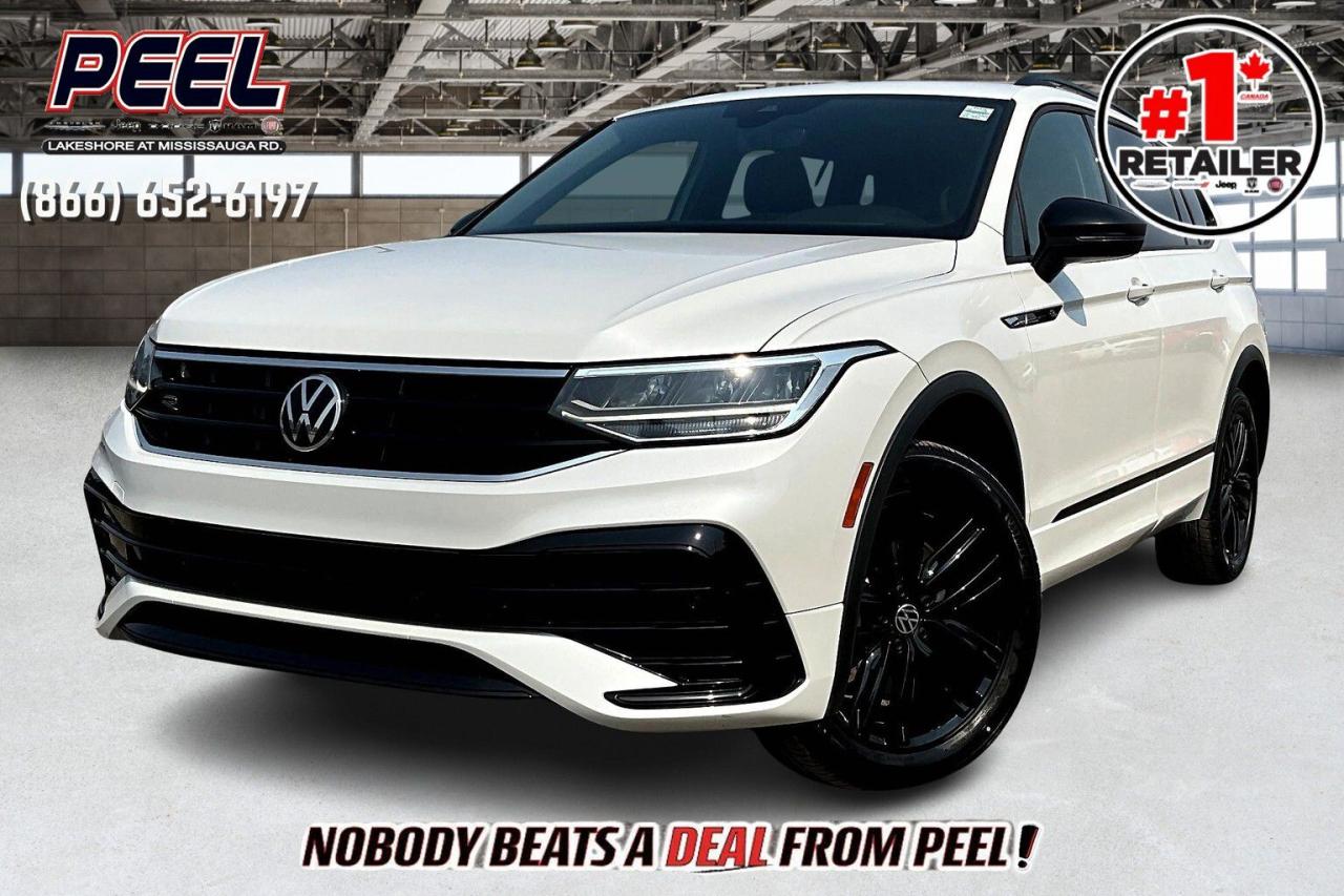 COME SEE WHY NOBODY BEATS A DEAL FROM PEEL! Your Source for ALL make and models used cars and trucks. Canadas #1 Stellantis Retailer for 8 years & counting!!

2022 Volkswagen Tiguan Comfortline R Line Black Edition | Oryx White Pearl | LOADED | Heated Leather Seats | Dual-pane Panoramic Sunroof | Heated Steering Wheel | Adaptive Cruise Control | Lane Keep Assist | Forward Collision Warning | Blind Spot Monitoring | Dual-zone Automatic Climate Control | Apple CarPlay & Android Auto | Wireless Charging Pad | 19" Gloss Black Alloy Wheels | Multi-terrain Select Dial

Clean Carfax | HAND SELECTED FORMER DAILY RENTAL

Experience the perfect blend of style, technology, and performance with this 2022 Volkswagen Tiguan Comfortline R Line Black Edition in stunning Oryx White Pearl. LOADED with premium features, this Tiguan offers heated leather seats, a heated steering wheel, and a dual-pane panoramic sunroof that adds luxury to every drive. Stay connected with Apple CarPlay, Android Auto, and a wireless charging pad, while the adaptive cruise control, lane keep assist, forward collision warning, and blind spot monitoring ensure peace of mind on the road. The dual-zone automatic climate control keeps you comfortable, and the 19" gloss black alloy wheels and multi-terrain select dial provide the versatility and style to tackle any journey. With a clean Carfax and being a hand-selected former daily rental, this Tiguan is in exceptional condition and ready for its next adventure. Dont miss out on this all-around impressive SUV!
______________________________________________________

Engage & Explore with Peel Chrysler: Whether youre inquiring about our latest offers or seeking guidance, 1-866-652-6197 connects you directly. Dive deeper online or connect with our team to navigate your automotive journey seamlessly.

WE TAKE ALL TRADES & CREDIT. WE SHIP ANYWHERE IN CANADA! OUR TEAM IS READY TO SERVE YOU 7 DAYS!
______________________________________________________

*FREE CarFax (click the link above to check it out at no cost to you!)*

*FULLY CERTIFIED! (Have you seen some of these other dealers stating in their advertisements that certification is an additional fee? NOT HERE! Our certification is already included in our low sale prices to save you more!)

______________________________________________________

Peel Chrysler  A Trusted Destination: Based in Port Credit, Ontario, we proudly serve customers from all corners of Ontario and Canada including Toronto, Oakville, North York, Richmond Hill, Ajax, Hamilton, Niagara Falls, Brampton, Thornhill, Scarborough, Vaughan, London, Windsor, Cambridge, Kitchener, Waterloo, Brantford, Sarnia, Pickering, Huntsville, Milton, Woodbridge, Maple, Aurora, Newmarket, Orangeville, Georgetown, Stouffville, Markham, North Bay, Sudbury, Barrie, Sault Ste. Marie, Parry Sound, Bracebridge, Gravenhurst, Oshawa, Ajax, Kingston, Innisfil and surrounding areas. On our website www.peelchrysler.com, you will find a vast selection of new vehicles including the new and used Ram 1500, 2500 and 3500. Chrysler Grand Caravan, Chrysler Pacifica, Jeep Cherokee, Wrangler and more. All vehicles are priced to sell. We deliver throughout Canada. website or call us 1-866-652-6197. 

Your Journey, Our Commitment: Beyond the transaction, Peel Chrysler prioritizes your satisfaction. While many of our pre-owned vehicles come equipped with two keys, variations might occur based on trade-ins. Regardless, our commitment to quality and service remains steadfast. Experience unmatched convenience with our nationwide delivery options. All advertised prices are for cash sale only. Optional Finance and Lease terms are available. A Loan Processing Fee of $499 may apply to facilitate selected Finance or Lease options. If opting to trade an encumbered vehicle towards a purchase and require Peel Chrysler to facilitate a lien payout on your behalf, a Lien Payout Fee of $299 may apply. Contact us for details. Peel Chrysler Pre-Owned Vehicles come standard with only one key.