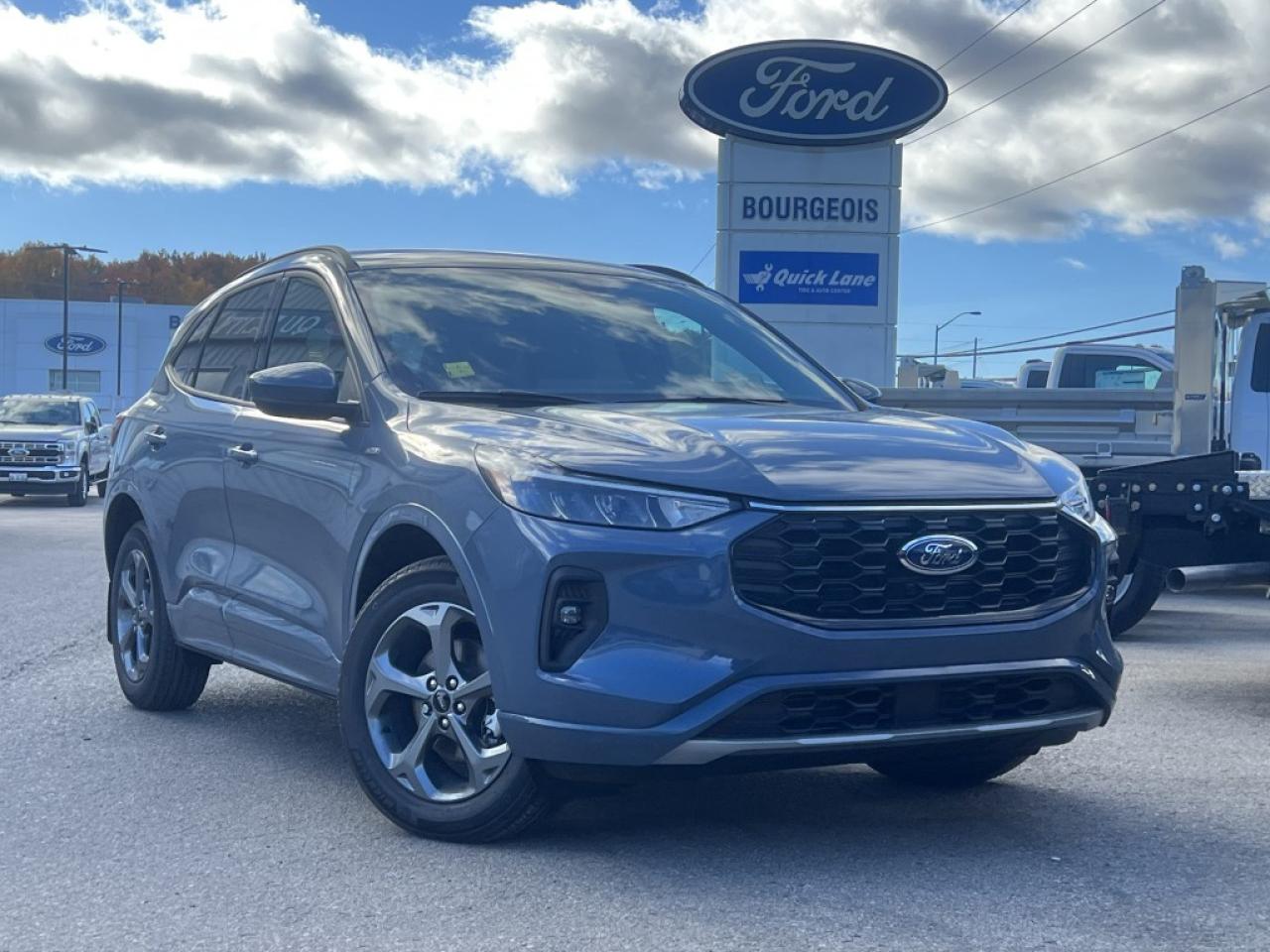 <p>Introducing the exceptional new Ford Escape ST-Line Select AWD, cloaked in a stunning blue that perfectly complements its robust and versatile design. Engineered for those who yearn for adventure without sacrificing comfort, this formidable SUV boasts an intelligent all-wheel-drive system that promises an exhilarating yet secure driving experience on any terrain.</p><p>The exterior of the Escape ST-Line Select AWD is nothing short of breathtaking, featuring sleek alloy wheels that add a touch of sophistication to its athletic stance. Inside, passengers are welcomed into a sanctuary of comfort, with heated seats, a heated steering wheel, and air conditioning creating an oasis of comfort. The contemporary styling is enhanced by power seats that adjust to meet your exact preferences, ensuring every journey is a pleasure.</p><p>Technology enthusiasts will delight in the Escape ST-Line Select AWD's advanced features, including a backup camera that simplifies parking, a Bluetooth connection for effortless streaming, and smart device integration to keep you connected on the go. Safety is paramount, with lane assist and brake assist systems providing peace of mind, while the satellite radio and Wi-Fi hotspot ensure entertainment is always at your fingertips.</p><p>Perfect for the modern adventurer or the family looking for a reliable, stylish, and feature-packed SUV, the Ford Escape ST-Line Select AWD is waiting to elevate your driving experience. Don't miss the chance to own this flawless combination of performance, technology, and comfort. Contact the dealership today for more information and prepare to embark on your next adventure with confidence.</p> <p><span style=color:rgb( 58 , 80 , 95 )>The discount shown on vehicle represents the </span><u>Cash Purchase</u><span style=color:rgb( 58 , 80 , 95 )> discount and is inclusive of all non-stackable and stackable cash purchase discounts from Ford of Canada and Bourgeois Motors Ltd. and is offered in lieu of sub-vented lease or finance rates. To get details on current discounts applicable to this and other vehicles in our inventory for Lease and Finance customer, see a member of our team. All offers for lease or finance are On Approved Credit (OAC).While every effort is made to ensure the accuracy of discounts and programs, programs are subject to change without notice </span><span style=color:rgb( 119 , 119 , 119 )>and may not be accurate or completely current. While every reasonable effort is made to ensure the accuracy of this data, we are not responsible for any errors or omissions contained on these pages.</span></p> <p><strong>Why Choose the Bourgeois Auto Group?</strong></p><p>For 80 years, Bourgeois Auto Group has been delivering exceptional automotive experiences. Our factor trained teams work to ensure you receive the shopping experience you deserve; whether you're looking for a new or new-to-you vehicle.</p><p>Shop 24/7 with our online showroom and chat service, ensuring convenience every step of the way. No hidden fees, full disclosure, and every pre-owned vehicle comes with a Carfax® report for peace of mind.</p><p>We offer a wide selection of pre-owned vehicles, all competitively priced using real-time market data. Get the best deal on your purchase and trade-in with our free Live Market Analysis report.</p><p>Looking to sell your car? We buy any make or modelno purchase required. Our simple to use online trade valuation tool will provide you with a clear, transparent selling experience whether you buy our car or not.</p><p>Backed by hundreds dedicated employees across 4 convenient locations, were here to meet all your automotive needs. Visit us in Midland or Parry Sound and explore our inventory or schedule your next service today.</p> <p><strong>Financing Your Next Vehicle with Bourgeois Motors Ford in Midland:</strong></p><p>At Bourgeois Motors Ford, we make financing your next vehicle simple and stress-free! Our team works with trusted lenders to find flexible options tailored to your budget. Drive away with confidenceapply today!</p><p>Take advantage of our online pre-qualification tool, backed by Equifax and TD Bank to find the payment that works for you. Simply <a href=https://www.bourgeoismotors.com/free-credit-check/ rel=nofollow><strong>CLICK HERE</strong></a><strong> </strong>to use our secure online credit tool with no impact to your credit.</p> <p><strong>This Is a Dealer Demonstrator. </strong>Experience exceptional value with Bourgeois Motors Fords executive demos. These are like-new vehicles with low mileage, premium features, and significant savings. Drive away with confidence, backed by the balance of factory warranties and our commitment to quality. Its a great way to own a new Ford.</p>