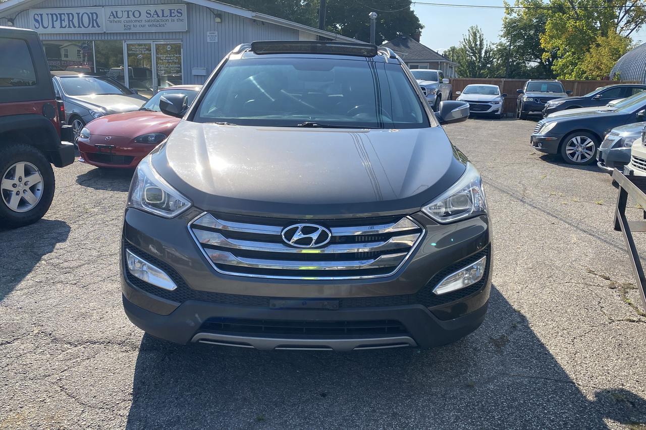<p>Carfax clean!</p><p>Great affordable CERTIFIED used vehicles in a budget you can manage.</p><p>&nbsp;</p><p>We accept all types of credit and income, be it new or thin*. Vehicles can be financed with up to 300K km*.&nbsp; Call, email or come by the office and ask for details. Our vehicles come standard with&nbsp;<strong>*one key.*&nbsp; Taxes, Licensing & OMVIC fees are extra.</strong></p><p><strong>*On approved credit, conditions may apply</strong></p><p>Member of OMVIC and UCDA</p><p>Get ready to elevate your driving experience with this luxurious 2014 Hyundai Santa Fe Sport Limited, now available at Superior Auto Sales. This sleek, gray SUV boasts a spacious and comfortable black leather interior, perfect for both city commutes and weekend adventures. With its powerful engine and all-wheel drive system, youll be able to confidently navigate any terrain, while enjoying the peace of mind that comes with knowing your family is safe and secure.</p><p>This Santa Fe Sport is packed with features designed to make your journey more enjoyable and convenient. Cruise effortlessly with heated and cooled seats, a heated steering wheel, and keyless entry and start. Enjoy premium sound with the integrated navigation system, satellite radio, and premium sound system. And rest assured, with features like a back-up camera, blind spot monitor, and a comprehensive safety suite, youll have all the tools you need to stay safe on the road.</p><p>This well-maintained vehicle has 156,603km on the odometer and is ready to tackle the road ahead. Visit Superior Auto Sales today to experience this remarkable SUV firsthand.</p><p><strong>Here are 5 of the most enticing features:</strong></p><ul><li><strong>Heated and Cooled Seats:</strong> Experience ultimate comfort year-round with both heated and cooled front seats.</li><li><strong>Heated Steering Wheel:</strong> Warm your hands on cold days with the comfort of a heated steering wheel.</li><li><strong>Blind Spot Monitor:</strong> Drive with confidence, knowing youre alerted to vehicles in your blind spot.</li><li><strong>Premium Sound System:</strong> Enjoy an immersive audio experience with a high-quality sound system.</li><li><strong>Keyless Entry and Start:</strong> Skip the fumbling with keyless entry and start for effortless convenience.</li></ul><p><em>Powered by AutoIntelligence&trade; AI</em></p>