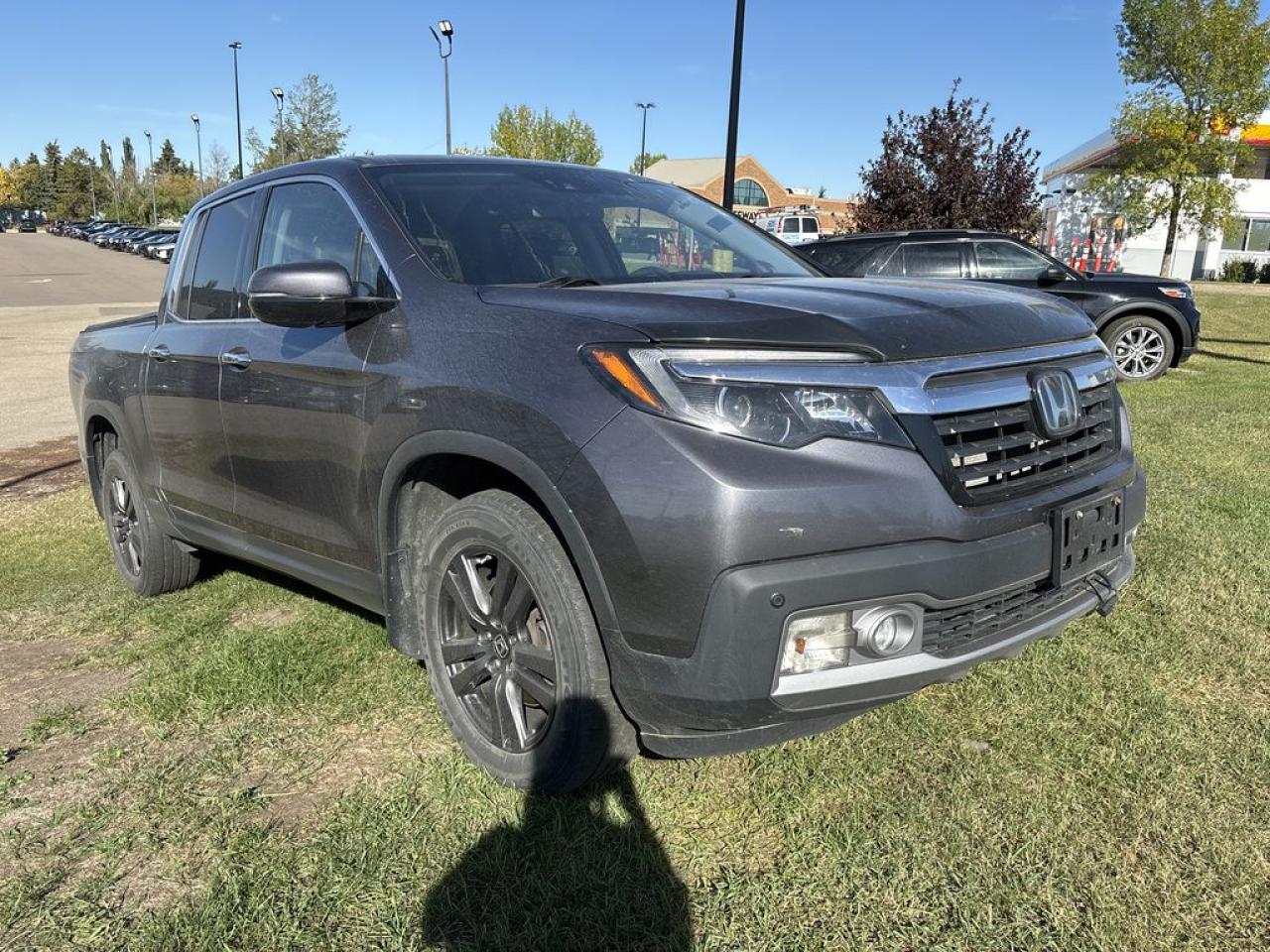 <p>Meet the 2019 Honda Ridgeline RTL Crew Cab AWD in Modern Steel Metallic delivers an unrivaled blend of ingenuity, functionality, and stylish sophistication! Powered by a 3.5 Liter V6 that delivers 280hp connected to a 6 Speed Automatic transmission for amazing passing requirements. This All Wheel Drive combination delivers a remarkably smooth ride superior to other trucks with its fully independent suspension and rewards you with nearly approximately 9.4L/100km on the highway. Step up to the unique Ridgeline RTL with its dual-action tailgate, integrated trailer hitch, and truck bed lights. Youll also appreciate the lockable trunk with 7.3 cubic ft of versatile storage that even features a drain so you can use it as a cooler!</p>  <p>The roomy RTL cabin comfortably seats five and has the most passenger space in its class. Its features include heated leather seats, remote engine start, smart entry, an acoustic windshield, HomeLink, and tri-zone automatic climate control. Check out the multi-information screen, full power accessories, and incredible audio with USB, Bluetooth®, and a prominent display screen!</p>  <p>Youll hit the ground running without a care since this Honda has been carefully engineered with ABS, stability/traction control, advanced airbags, daytime running lights, a tire pressure monitor and a rearview camera. This incredible Ridgeline RTL belongs at the top of your list! Save this Page and Call for Availability. We Know You Will Enjoy Your Test Drive Towards Ownership!</p>  <p>This vehicle is being sold as is. This refers to the stipulation where the buyer agrees to purchase the vehicle in its current condition, without legal recourse should the buyer discover a defect in the vehicle after purchase. Pricing can vary depending on having repairs completed. Please contact dealer for details.</p>  <p>Call 587-409-5859 for more info or to schedule an appointment! Listed Pricing is valid for 72 hours. Financing is available, please see dealer for term availability and interest rates. AMVIC Licensed Business.</p>