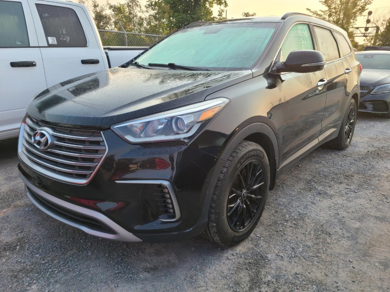 <p>Looking for a spacious and well-equipped SUV that can handle anything? Look no further than this 2017 Hyundai Santa Fe XL, available now at Paulette Auto Sales! This black beauty boasts a powerful 6-cylinder engine, a smooth automatic transmission, and all-wheel drive for confident handling in any weather. With 141,143km on the odometer, this Santa Fe XL has plenty of life left in it and is ready for your next adventure.</p><p>Inside, youll find a comfortable and well-appointed cabin with features like heated front seats and a heated steering wheel to keep you cozy on those chilly mornings. Stay connected with the built-in CD player, or use your phone with the Bluetooth connection. And for added peace of mind, the Santa Fe XL comes equipped with a comprehensive safety suite that includes anti-lock brakes, driver and passenger airbags, side airbags, and traction control.</p><p>Here are five of the Santa Fe XLs most sizzle-worthy features:</p><ol><li><strong>All-Wheel Drive:</strong> Take on any road condition with confidence, knowing you have the traction you need.</li><li><strong>Heated Front Seats and Steering Wheel:</strong> Stay warm and comfortable on those cold Canadian mornings.</li><li><strong>Blind Spot Monitor:</strong> Drive with greater peace of mind, knowing you have an extra set of eyes on the road.</li><li><strong>Automatic Headlights:</strong> Let the car take care of the lighting, so you can focus on the road ahead.</li><li><strong>Spacious Interior:</strong> With its SUV/crossover body style and 4 doors, this Santa Fe XL offers plenty of room for passengers and cargo.</li></ol><p>Come down to Paulette Auto Sales today and see this 2017 Hyundai Santa Fe XL for yourself!</p>