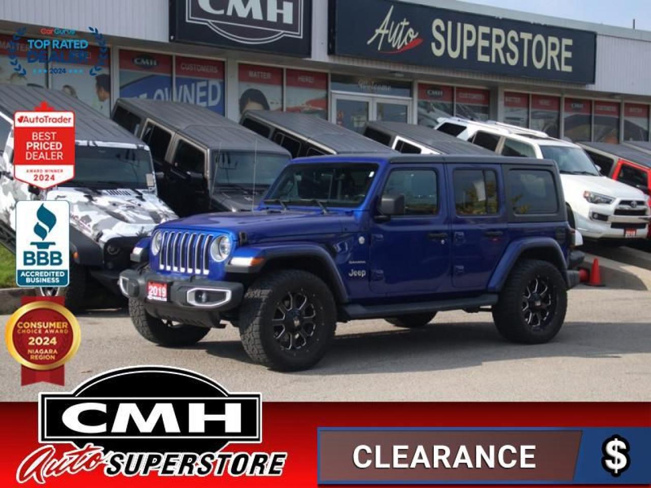 <b>ONLY 70,000 KMS !! 4X4 !! NAVIGATION, REAR CAMERA, PARK SENSORS, BLIND SPOT, APPLE CARPLAY, ANDROID AUTO, STEERING WHEEL CONTROLS, LEATHER, HEATED SEATS, HEATED STEERING WHEEL, DUAL CLIMATE CONTROL, REMOTE START, PREMIUM TIRES, AFTERMARKET 20-INCH ALLOYS</b><br>  <br>CMH certifies that all vehicles meet DOUBLE the Ministry standards for Brakes and Tires<br><br> <br>    This  2019 Jeep Wrangler Unlimited is for sale today. <br> <br>This Wrangler Unlimited is by no means less capable for having 4 doors. Its just able to carry more people and gear. Whether your familys next adventure is across a mountain pass, through a muddy trail, or just down the highway to Grandmas, this Wrangler Unlimited has you covered. This  SUV has 70,884 kms. Its  blue in colour  . It has an automatic transmission and is powered by a  285HP 3.6L V6 Cylinder Engine. <br> <br> Our Wrangler Unlimiteds trim level is Sahara. This Unlimited Sahara Wrangler has a lot more goodies over the base Sport model. To make sure you and your passengers stay connected and entertained, you will get the Uconnect 4 with 7 inch touchscreen, Apple CarPlay, Android Auto, SiriusXM, Bluetooth, 4 USBs and and aux jack, 8 speakers, and ambient interior LED lighting.  Skid plates, a tool kit, two front tow hooks and one rear, Dana axles, shift on the fly 4x4 system, heavy duty suspension, fog lights, automatic headlamps, aluminum wheels, and tubular side steps help you rule the trail, while a rear view camera, illuminated cup holders, leather steering wheel with audio and cruise control, remote keyless entry, power windows, 115 volt power outlet, automatic climate control, and heated power side mirrors help you stay comfortable on the road. This vehicle has been upgraded with the following features: Uconnect,  Aluminum Wheels,  Android Auto,  Apple Carplay,  Dana Axles,  Steering Wheel Audio Control,  Fog Lamps. <br> To view the original window sticker for this vehicle view this <a href=http://www.chrysler.com/hostd/windowsticker/getWindowStickerPdf.do?vin=1C4HJXEG9KW541286 target=_blank>http://www.chrysler.com/hostd/windowsticker/getWindowStickerPdf.do?vin=1C4HJXEG9KW541286</a>. <br/><br> <br>To apply right now for financing use this link : <a href=https://www.cmhniagara.com/financing/ target=_blank>https://www.cmhniagara.com/financing/</a><br><br> <br/><br>Trade-ins are welcome! Financing available OAC ! Price INCLUDES a valid safety certificate! Price INCLUDES a 60-day limited warranty on all vehicles except classic or vintage cars. CMH is a Full Disclosure dealer with no hidden fees. We are a family-owned and operated business for over 30 years! o~o