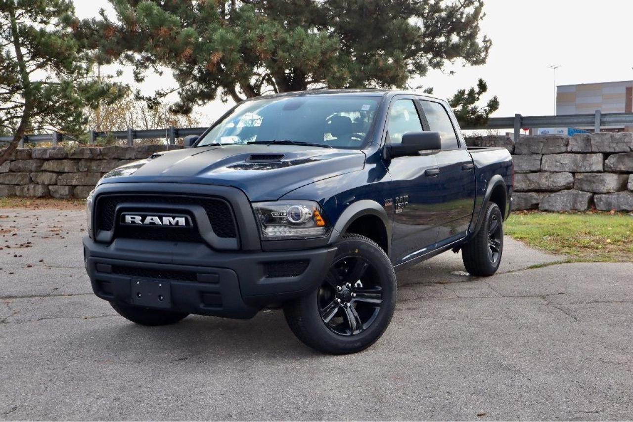 Dealer installed running boards additional $997  Standing strong, our New 2024 RAM 1500 Classic Warlock Crew Cab 4X4 with Heated Seats & Steering Wheel is a smart choice for getting things done in Patriot Blue Pearl! Motivated by a 5.7 Litre HEMI V8 providing 395hp to an 8 Speed Automatic transmission for easy access to mighty muscle. This Four Wheel Drive truck is a high-capability work machine that inspires confidence with its calm handling and sees approximately 11.8L/100km on the highway. Our RAM rocks a dark design theme with LED fog lamps, 20-inch high-gloss black wheels, an exclusive black grille, black powder-coated bumpers, cargo-box lighting, a spray-on bedliner, and a Class III bumper hitch.  Heated cloth front seats and a heated steering wheel greet you in our Warlock cabin. The long list of standard amenities also includes air conditioning, power accessories, keyless entry, cruise control, a 5-inch touchscreen, Bluetooth®, voice control, a 3.5-inch driver display, a 12V outlet, and a six-speaker sound system with SiriusXM compatibility. Youll find room to spread out and store your stuff, too!  RAM helps you keep out of harms way with some help from rear parking sensors, a rearview camera, all-speed traction control, electronic stability control, ABS, tire pressure monitoring, advanced airbags, dynamic front crumple zones, and more. Look no further than our 1500 Classic Warlock when youre looking for your next rewarding truck! Save this Page and Call for Availability. We Know You Will Enjoy Your Test Drive Towards Ownership!