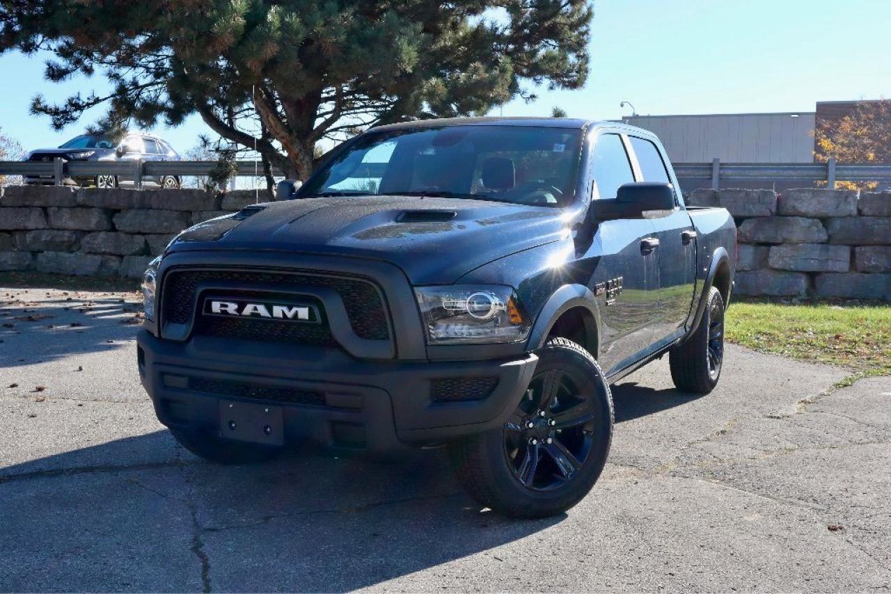 Dealer installed running boards additional $997   Standing strong, our New 2024 RAM 1500 Classic Warlock Crew Cab 4X4 with the Electronics Pack is a smart choice for getting things done in Patriot Blue Pearl! Motivated by a 5.7 Litre HEMI V8 providing 395hp to an 8 Speed Automatic transmission for easy access to mighty muscle. This Four Wheel Drive truck is a high-capability work machine that inspires confidence with its calm handling and sees approximately 11.8L/100km on the highway. Our RAM rocks a dark design theme with LED fog lamps, 20-inch high-gloss black wheels, an exclusive black grille, black powder-coated bumpers, cargo-box lighting, and a Class III bumper hitch.  Comfortable cloth seats and rewarding features greet you in our Warlock cabin. The long list of standard amenities also includes air conditioning, power accessories, a tilt-adjustable steering wheel, keyless entry, cruise control, a 12V outlet, and a six-speaker sound system. Our Electronics Pack upgrades the interior with dual-zone automatic climate control, an 8.4-inch touchscreen, a 7-inch driver display, Apple CarPlay®, Android Auto®, Bluetooth®, and a six-speaker sound system.  RAM helps you keep out of harms way with some help from rear parking sensors, a rearview camera, all-speed traction control, electronic stability control, ABS, tire pressure monitoring, advanced airbags, dynamic front crumple zones, and more. Look no further than our 1500 Classic Warlock when youre looking for your next rewarding truck! Save this Page and Call for Availability. We Know You Will Enjoy Your Test Drive Towards Ownership!