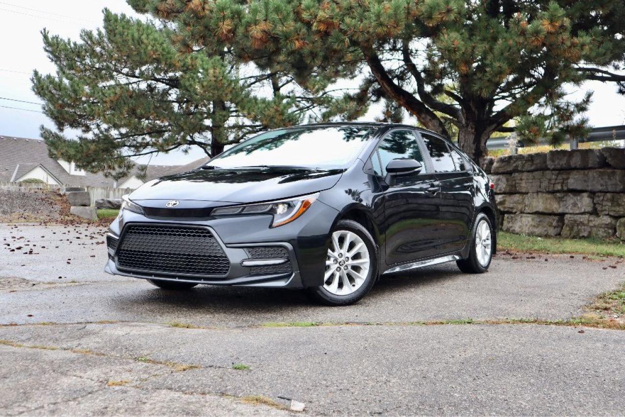 BACKUP CAMERA, BLUETOOTH, HEATED SEATS, BLIND SPOT MONITORING, LANE KEEP ASSIST, CRUISE CONTROL, AND MORE!

Sporty and compact, our One Owner, Accident-Free 2022 Toyota Corolla SE Sedan has a lively spirit and looks great in Black Sand Pearl. Motivated by a 2.0 Litre 4 Cylinder generating 169hp paired to a paddle-shifted CVT so you can discover more fun on every trip. This Front Wheel Drive sedan sips fuel, too, seeing approximately 5.9L/100km on the highway. A bold design brings out our Corollas athletic side with upgraded LED lighting, a sport-style mesh grille, prominent rocker panels, alloy wheels, and dual chrome-tipped exhaust outlets.

Our SE cabin keeps you happy with impressive comfort and upscale details, highlighted by premium performance heated front seats, a leather-wrapped steering wheel, automatic climate control, and remote keyless entry. Youll also appreciate the digital convenience of an 8-inch touchscreen, WiFi compatibility, Apple CarPlay, Android Auto, Amazon Alexa compatibility, Bluetooth, and a six-speaker sound system. Features like those make connecting a breeze!

Toyota Safety Sense technology takes care of you as you go with automatic braking, lane-departure alert, lane-keeping assistance, pedestrian detection, adaptive cruise control, and a backup camera. Our Corolla SE is a small car with a big attitude! Save this Page and Call for Availability. We Know You Will Enjoy Your Test Drive Towards Ownership! 

Bustard Chrysler prides ourselves on our expansive used car inventory. We have over 100 pre-owned units in stock of all makes and models, with the largest selection of pre-owned Chrysler, Dodge, Jeep, and RAM products in the tri-cities. Our used inventory is hand-selected and we only sell the best vehicles, for a fair price. We use a market-based pricing system so that you can be confident youre getting the best deal. With over 25 years of financing experience, our team is committed to getting you approved - whether you have good credit, bad credit, or no credit! We strive to be 100% transparent, and we stand behind the products we sell. For your peace of mind, we offer a 3 day/250 km exchange as well as a 30-day limited warranty on all certified used vehicles.