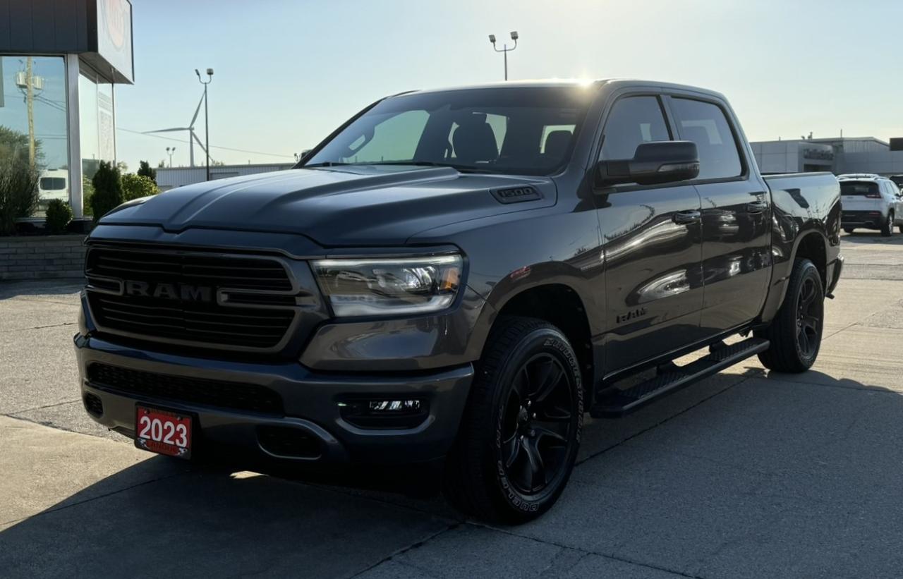 <p style=text-align: center;><strong><span style=font-size: 18pt;>2023 RAM 1500 SPORT 4X4 CREW CAB 57 BOX</span></strong></p><p style=text-align: center;><strong><span style=font-size: 18pt;>5.7L HEMI VVT V8 ENGINE W/FUELSAVER MDS & ETORQUE </span></strong></p><p style=text-align: center;><span style=font-size: 14pt;>395 HORSEPOWER | 410 LB-FT OF TORQUE | 3.21 REAR AXLE RATIO</span></p><p style=text-align: center;><span style=font-size: 14pt;>TOWING CAPACITY: 8,120 LBS | PAYLOAD: 1,830 LBS | GVWR: 7,100 LBS</span></p><p style=text-align: center;><span style=font-size: 14pt;>10.5L/100KM HIGHWAY | 13.5L/100KM CITY | 12.1L/100KM COMBINED</span></p><p style=text-align: center;><strong><span style=font-size: 18pt;>8-SPEED AUTOMATIC TRANSMISSION</span></strong></p><p style=text-align: center;><strong><span style=font-size: 18pt;>20 PREMIUM PAINTED/POLISHED WHEELS</span></strong></p><p style=text-align: center;> </p><p style=text-align: center;><strong><span style=font-size: 14pt;>STANDARD / FUNCTIONAL EQUIPMENT</span></strong></p><p style=text-align: center;><span style=font-size: 14pt;>730 Amp Maintenance Free Battery, Brake Assist, Electronic Stability Control, Hill Start Assist, Traction Control, Electronic Roll Mitigation, Trailer Sway Damping, Anti-lock 4-wheel Disc Brakes, Child Seat Anchor System - Latch Ready, Carpet Floor Covering, Cargo Tie Down Loops, Front & Rear Floor Mats, Door Sill Scuff Pads, Driver/Passenger Assist Handles, Deluxe Door Trim Panel, Full Length Upgraded Floor Console, Premium Overhead Console, Rotary Shifter, Shift on Demand Transfer Case, 3.21 Rear Axle Ratio, Tinted Glass Windows, Acoustic Front Door Glass, Deep Tint Sunscreen, Glass Rear Window Defroster, Rear Power Sliding Window, Sun Visors w/ Illuminated Vanity Mirrors, Rear View Auto Dim Mirror, Body Colour Premium Power Mirrors, 2-Door Passive Entry, Front Door Locks, Remote Keyless Entry, Sentry Key Theft Deterrent System, Push-Button Start, Air Conditioning w/ Dual Zone Control, 12 Color Display, Intermittent Windshield Wipers, Dual Note Electric Horns, 12V Auxiliary Power Outlet, 115V Auxiliary Power Outlet, Power Accessory Delay, Speed Sensitive Power Locks, Power Front Windows, 1-Touch Up & Down, Illuminated Entry, Tire Fill Alert, Front Passenger Seat Belt Alert, LED Taillamps, Vehicle Information Center, LED Dome Lamp w/ on/off Switch, LED Footwell Lighting, Headlamp Off Time Delay, Overhead LED Lamps, Automatic Headlamps, Auto High Beam Headlamp Control, Daytime Running Headlamps, LED Low Beam, LED Fog Lamps, LED Reflector Headlamps, Full Speed Forward Collision Warning , Body Color Front Bumper, Body Color Rear Bumper w/ Step Pads, Front Wheel Well Liners, Body Color Door Handles, 26 Gallon (98.5L) Fuel Tank, Engine Block Heater, Speed Control, 9 Amplified Speakers w/ Subwoofer, Steering Wheel Mounted Audio Control, Media Hub-2 USB, Full Function, Remote USB Port, Electric Power Steering, Front Heavy Duty Shock Absorbers, Rear Heavy Duty Shock Absorbers, Front Stabilizer Bar, Rear Stabilizer Bar, Tilt/Telescope Steering Column, Tire Carrier Winch, Full Size Temporary Use Spare Tire, Uconnect 5 Nav w 12.0 Display, Center Hub, 20x9.0 Premium Paint/polished Wheels, Parkview Rear Back-up Camera, Power Adjustable Pedals, Electric Park Brake, Class III Bumper Hitch, 7 Pin Wiring Harness, Front/Rear Climate Control, Universal Garage Door Opener, Tire Pressure Monitoring Display, 400W Inverter, Locking Tailgate, Capless Fuel Fill, Four Wheel Drive</span></p><p style=text-align: center;> </p><p style=text-align: center;><span style=font-size: 14pt;><strong>OPTIONAL EQUIPMENT</strong></span></p><p style=text-align: center;><span style=font-size: 14pt;><em><span style=text-decoration: underline;>Rebel Level 1 Equipment Group:</span></em></span><br /><span style=font-size: 14pt;>Switchable rear dome lamp, Automatic-dimming interior rearview mirror, Exterior power-folding mirrors with signal and puddle lamps, Overhead console, Universal garage door opener, Power-adjustable pedals, Heated front seats, Heated steering wheel, Rear defroster, Uconnect 8.4 AM/FM/Bluetooth/SiriusXM Radio, Driver-side sun visor mirror and light</span></p><p style=text-align: center;><span style=font-size: 14pt;><em><span style=text-decoration: underline;>Bed Utility Group:</span></em></span><br /><span style=font-size: 14pt;>4 adjustable Mopar cargo tie–down hooks, Pick–up box lighting, Mopar deployable bed step </span></p><p style=text-align: center;><span style=font-size: 14pt;><em><span style=text-decoration: underline;>5.7L HEMI VVT V8 engine w/FuelSaver MDS & eTorque</span></em></span></p><p style=text-align: center;><span style=font-size: 14pt;><em><span style=text-decoration: underline;>Rear wheelhouse liners</span></em></span></p><p style=text-align: center;> </p><p style=text-align: center;> </p><p style=box-sizing: border-box; margin-bottom: 1rem; margin-top: 0px; color: #212529; font-family: -apple-system, BlinkMacSystemFont, Segoe UI, Roboto, Helvetica Neue, Arial, Noto Sans, Liberation Sans, sans-serif, Apple Color Emoji, Segoe UI Emoji, Segoe UI Symbol, Noto Color Emoji; font-size: 16px; background-color: #ffffff; text-align: center; line-height: 1;><span style=box-sizing: border-box; font-family: arial, helvetica, sans-serif; font-size: 14pt;><span style=box-sizing: border-box; font-weight: bolder;><span style=box-sizing: border-box;>Here at Lanoue/Amfar Sales, Service & Leasing in Tilbury, we take pride in providing the public with a wide variety of High-Quality Pre-owned Vehicles. We recondition and certify our vehicles to a level of excellence that exceeds the Status Quo. We treat our Customers like family and provide the highest level of service from Start to Finish. If you’d like a smooth & stress-free car shopping experience, give one of our Sales Associates a call at 1-844-682-3325 to help you find your next NEW-TO-YOU vehicle!</span></span></span></p><p style=box-sizing: border-box; margin-bottom: 1rem; margin-top: 0px; color: #212529; font-family: -apple-system, BlinkMacSystemFont, Segoe UI, Roboto, Helvetica Neue, Arial, Noto Sans, Liberation Sans, sans-serif, Apple Color Emoji, Segoe UI Emoji, Segoe UI Symbol, Noto Color Emoji; font-size: 16px; background-color: #ffffff; text-align: center; line-height: 1;><span style=box-sizing: border-box; font-family: arial, helvetica, sans-serif; font-size: 14pt;><span style=box-sizing: border-box; font-weight: bolder;><span style=box-sizing: border-box;>Although we try to take great care in being accurate with the information in this listing, from time to time, errors occur. The vehicle is priced as it is physically equipped. Minor variances will not effect pricing. Please verify the vehicle is As Expected when you visit. Thank You!</span></span></span></p>