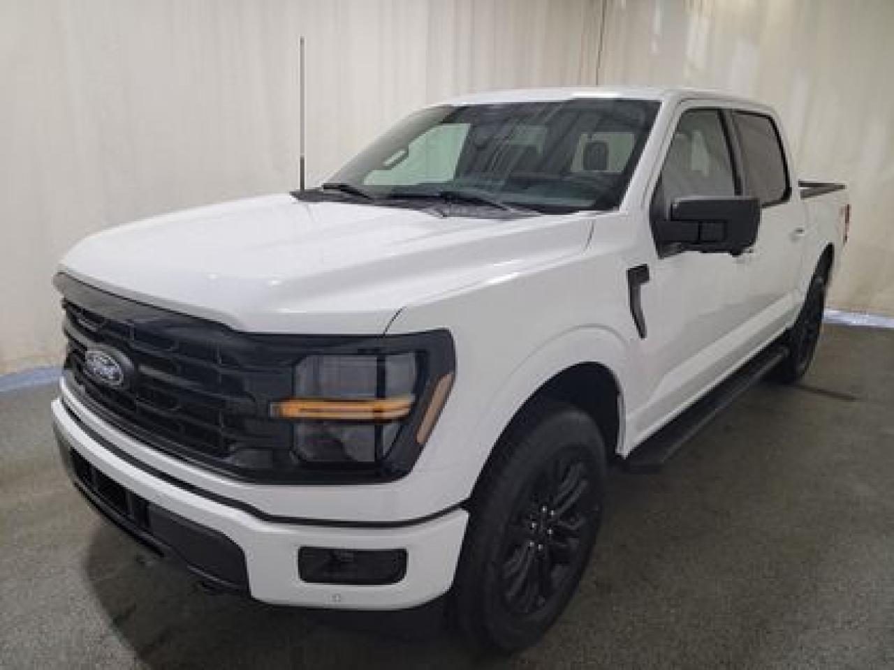 This all new, full sized 2024 Ford F-150 XLT 302A looks absolutely stunning in Oxford White. This pick up comes with the 3.5L EcoBoost engine. This remarkable engine not only produces 400 horsepower and 500 ft pounds of torque, but by leveraging the EcoBoost technology and a 10-speed automatic transmission this truck is rated it to get 12.3L 100/km (23 miles per gallon) combined highway/city fuel economy. This truck can tow up to a massive amount of 13,200 pounds!

Key Features:
XLT Black Appearance Package
275/60R-20 BSW All-Terrain
20 Gloss Black Aluminum Wheels
Engine Block Heater
FX4 Off Road Package
Skid Plates
Adaptive Cruise Control 
Lane Centering 
Heated Front Seats
Lane Keeping System 
Rear View Camera 
6 Black Running Boards 
Auto Dimming Rearview Mirror 
360 Degree Camera 
Pro Trailer Backup Assist 
Pro Trailer Hitch Assist 
Dual Exhaust 
Reverse Sensing System 
Reverse Brake Assist 
12 LCD Touchscreen 
Apple Car Play / Android Auto 
Rear Window Defroster 
Hill Start Assist 
Class IV Trailer Hitch 

Saskatchewan has a challenging climate and driving conditions but let that stress melt away with the 2024 F-150 XLT, a tough truck that leverages physical features and technology that will keep your family safe. This specific unit is loaded right up and includes power windows, power locks, air conditioning, 8-way power drivers seat, wrapped steering wheel, zone lighting, cruise, dynamic brake support, outside temperature display, hill start assist, perimeter safety system, four-wheel drive, and so much more. 

Bennett Dunlop Ford has been located at 770 Broad St, in the heart of Regina for over 40 years! Our 4.6 Star google review (Well over 1,800 reviews) is the result of our commitment to providing the fastest, easiest and most fun customer experience possible. Our customers tell us that they love that we dont charge any admin or documentation fees, our sales team will simply offer our best price upfront and we have a no-questions-asked money back guarantee just in case you change your mind after your purchase.