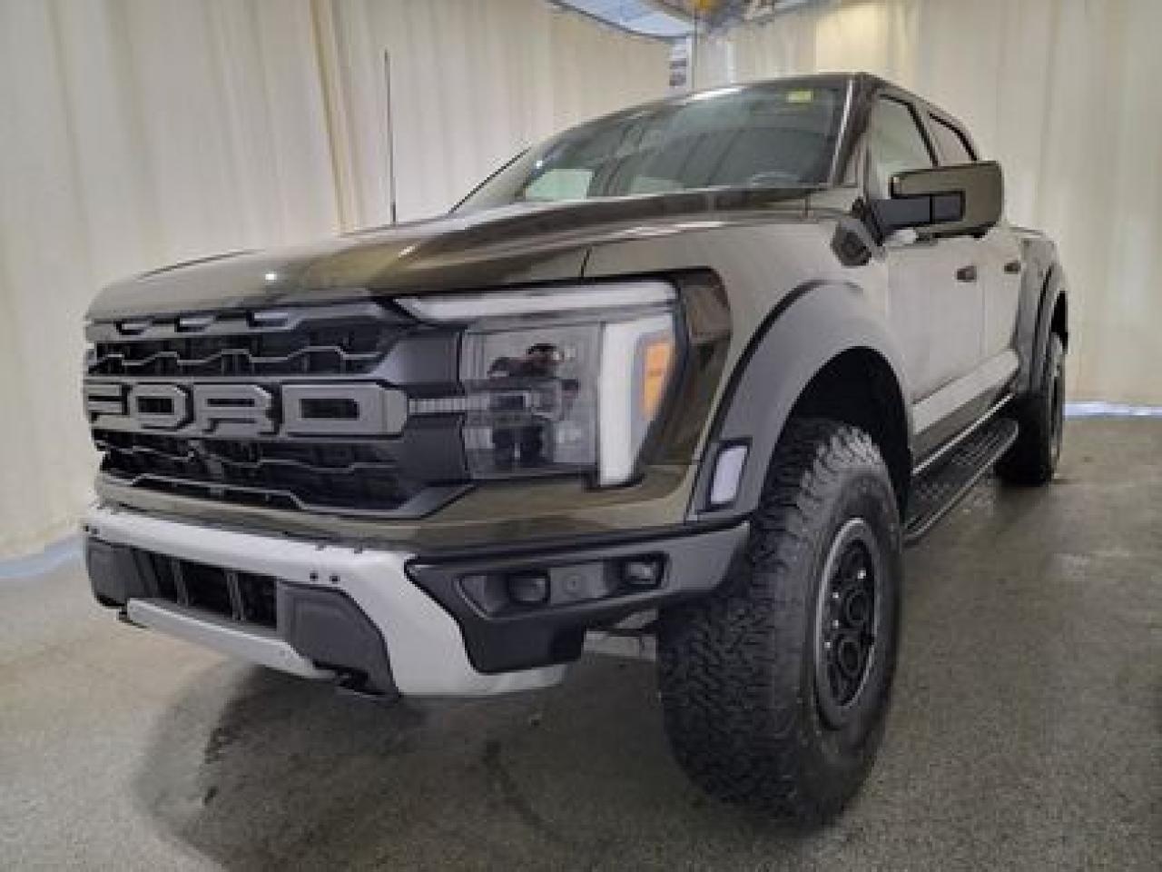 This all new, full sized 2024 Ford F-150 Raptor 802A 37 Raptor Package looks absolutely stunning in Shelter Green. This pick up comes with the 3.5L EcoBoost High Output engine. This remarkable engine not only produces 400 horsepower and 500 ft pounds of torque, but by leveraging the EcoBoost high output technology and a 10-speed automatic transmission. This truck can do 0-60 in a whopping 5.2 seconds!

Key Features:
Engine Block Heater
Twin Panel Moonroof
Bedliner Spray-In
37 Raptor Package
Carbon Fiber Interior 
17 Cast Aluminum Beadlock Wheels 
Dual Value Shocks 
Modular Front Bumper
Heated Seats 
Ventilated Front Seats 
Heated Steering Wheel 
Leather Shift Knob 
Remote Tailgate Release 
Remote Start System 
Adaptive Cruise Control 
Lane Centering 
Ford Co-Pilot 360 2.0
Lane Keep Assist 
Rear View Camera W/Hitch Assist 
Auto High Beams 
Reverse Sensing System 
360 Degree Camera 
B&O Unleashed Sound System 
Bed Utility Package 
Heads Up Display
Rain Sensing Wipers 
Mobile Office Package 
Pro Trailer Back Up Assist 
Wireless Charging Pad 
Universal Garage Door Opener 

Saskatchewan has a challenging climate and driving conditions but let that stress melt away with the 2024 F-150 Raptor 37 Package, a tough truck that leverages physical features and technology that will keep your family safe. This specific unit is loaded right up and includes power windows, power locks, air conditioning,10-way power drivers seat, wrapped steering wheel, 4.10 Electronic Locking Axle, 400W Outlet, ambient lighting, cruise, outside temperature display, hill start assist, perimeter safety system, four-wheel drive, and so much more. 

Bennett Dunlop Ford has been located at 770 Broad St, in the heart of Regina for over 40 years! Our 4.6 Star google review (Well over 1,800 reviews) is the result of our commitment to providing the fastest, easiest and most fun customer experience possible. Our customers tell us that they love that we dont charge any admin or documentation fees, our sales team will simply offer our best price upfront and we have a no-questions-asked money back guarantee just in case you change your mind after your purchase.