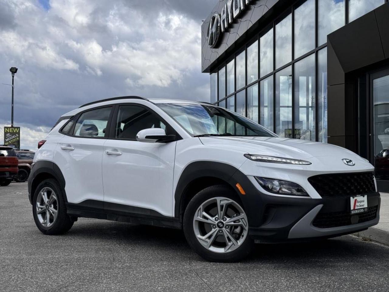 <p>Discover the allure of the Hyundai Kona Preferred in pristine white, a compact SUV that redefines the joy of driving with its efficient all-wheel-drive system. This model, specifically the 2.0L Preferred AWD with the Sun & Leather Package, combines sleek design with dynamic handling, making it an excellent choice for those who seek adventure and comfort in one package.</p><p>The Hyundai Kona stands out with its striking white exterior, complemented by stylish alloy wheels that not only enhance its appearance but also its road presence. Inside, the black leather seats and sunroof add a touch of luxury and openness, creating an inviting atmosphere for both driver and passengers. With features such as heated seats, a leather steering wheel, and a heated steering wheel, every drive ensures maximum comfort and style.</p><p>Technology enthusiasts will appreciate the Kona's advanced features, including a navigation system for effortless direction, a backup camera for added safety, and smart device integration to keep you connected. The inclusion of satellite radio, remote start, and a Bluetooth connection elevates the driving experience, ensuring entertainment and convenience on every journey. Safety is a priority with lane assist, brake assist, and adaptive cruise control, providing peace of mind and assistance when needed.</p><p>This Hyundai Kona, with its low mileage and comprehensive range of options and standards, is ideally suited for those who desire a blend of luxury, technology, and versatility. It's perfect for city dwellers seeking an efficient, comfortable SUV for daily commutes or weekend getaways. We invite you to contact the dealership today for more information and to experience the exceptional qualities of the Kona Preferred firsthand.</p> <p><strong>Financing Your Next Vehicle with Bourgeois Midland Hyundai:</strong></p><p>At Bourgeois Midland Hyundai, we make financing your next vehicle simple and stress-free! Our team works with trusted lenders to find flexible options tailored to your budget. Drive away with confidenceapply today!</p><p>Take advantage of our online pre-qualification tool, backed by Equifax and TD Bank to find the payment that works for you. Simply <a href=https://www.bourgeoishyundai.com/pre-qualify-for-financing/ rel=nofollow><strong>CLICK HERE</strong></a> to use our secure online credit tool with no impact to your credit. </p> <p><strong>Why Choose Bourgeois Midland Hyundai and the Bourgeois Auto Group?</strong></p><p>For over 75 years, Bourgeois Auto Group has been delivering exceptional automotive experiences. Our factor trained teams work to ensure you receive the shopping experience you deserve; whether you're looking for a new or new-to-you vehicle. </p><p>Shop 24/7 with our online showroom and chat service, ensuring convenience every step of the way. No hidden fees, full disclosure, and every pre-owned vehicle comes with a Carfax® report for peace of mind.</p><p>We offer a wide selection of pre-owned vehicles, all competitively priced using real-time market data. Get the best deal on your purchase and trade-in with our free Live Market Analysis report.</p><p>Looking to sell your car? We buy any make or modelno purchase required. Our simple to use online trade valuation tool will provide you with a clear, transparent selling experience whether you buy our car or not. </p><p>Backed by hundreds dedicated employees across 4 convenient locations, were here to meet all your automotive needs. Visit us in Midland and explore our inventory or schedule your next service today.</p>