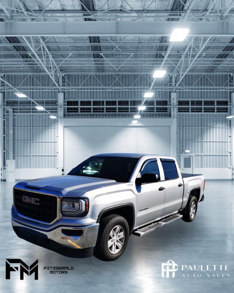 <p>Looking for a capable and reliable pickup truck that can handle any task you throw at it? Look no further than this 2018 GMC Sierra 1500, available now at Stephen Fitzgerald Motors. This silver 4-wheel drive beauty boasts an 8-cylinder engine, providing ample power for hauling and towing, while its automatic transmission ensures smooth and efficient driving. With its comfortable interior and a host of features, this Sierra is sure to impress.</p><p>This truck is ready to conquer any adventure, whether youre hauling cargo, towing a trailer, or simply cruising down the highway. While it has a few miles on the odometer (163,400km), its been well-maintained and is in excellent condition. Its a great option for anyone looking for a durable and reliable pickup truck at a great value.</p><p>Here are five features that make this GMC Sierra 1500 stand out:</p><ol><li><strong>4-wheel Drive:</strong> This Sierra offers the confidence of 4-wheel drive, making it capable of handling challenging terrain and delivering superior traction in all weather conditions.</li><li><strong>Powerful 8-cylinder Engine:</strong> This engine delivers the power you need for towing and hauling, while still offering efficient fuel economy for everyday driving.</li><li><strong>Automatic Transmission:</strong> Enjoy smooth and effortless shifting with the automatic transmission, enhancing your driving experience.</li><li><strong>Spacious and Comfortable Interior:</strong> The cabin offers plenty of space for passengers and cargo, making every trip enjoyable.</li><li><strong>Safety Features:</strong> The Sierra is equipped with features like anti-lock brakes, traction control, and multiple airbags to keep you and your passengers safe on the road.</li></ol><p>Contact Stephen Fitzgerald Motors today for more information on this 2018 GMC Sierra 1500.</p>