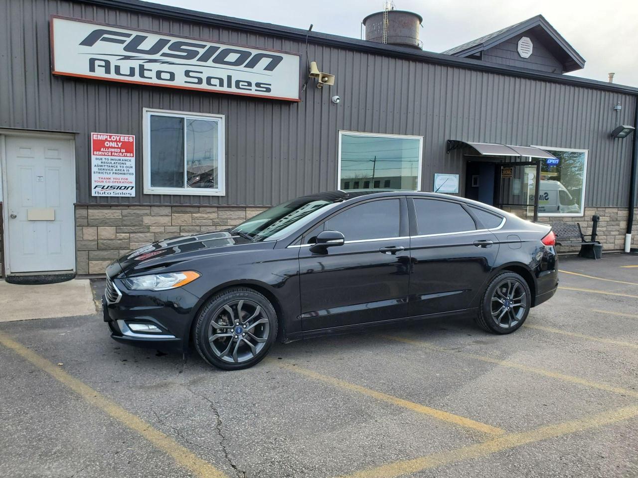 <p>2.0L 4Cyl EcoBoost, AWD, Auto, Sport Appearance Package with Blacked out Wheels & Rear Spoiler, Back Up Camera, Bluetooth, Lane Assist, Blind Spot Detection, Cross Traffic Alert, and more. Lic & HST Extra. </p><p>The Fusion Philosophy<br /><br />At Fusion Auto Sales, we put more effort into buying our vehicles than we do trying to sell them. By constantly monitoring what other car lots are doing, we strive to be the lowest priced dealer in our market. We won’t purchase a vehicle to “fill a hole”. We know that the vehicles on our lot are great value for the money and smart shoppers realize that also. Adhering to this philosophy makes it easy for our customers. If they find a vehicle on our lot that fulfills their needs and wants, they know that they’re getting great value. <br /><br />If we don’t have what you’re looking for, we can find it! Over 150 customers have saved thousands of dollars buy joining our” locate club”. People that know what they want and what they want to pay (within reason of course), get the vehicle of their dreams and enjoy huge savings. Contact us for details.<br /><br /><br /><br />Fusion Auto Sales is in Tilbury, Ont. located between Windsor and London right off the 401. We are among 7 dealerships within a &frac12; kilometer distance which is great for out of town shoppers. We began satisfying customers in 2009 and have been doing so ever since. In 2012 Fusion was recognized as 1 of the 50 fastest growing companies in Canada. And then, in 2018, we were named one of the top 5 independent automobile dealerships in the country. <br /><br />We specialize in late model vehicles at below than average pricing, everything is fully certified and every unit is Car Proof verified and is fully disclosed with every unit. We offer every type of financing from perfect credit at great rates to credit challenges with competitive rates. We also specialize in locating vehicles for customers, we cant have everything on the lot so if you do not see it and are having a hard time finding what you are looking for, let us know and we can find it for you. Fusion Auto Sales spans its customer base from Windsor all the way to Timmins, On and every where in between. Our philosophy is You are going to like the way we deal and everyone does, straight honest answers with no monkey business and no back and forth between sales and managers.</p>