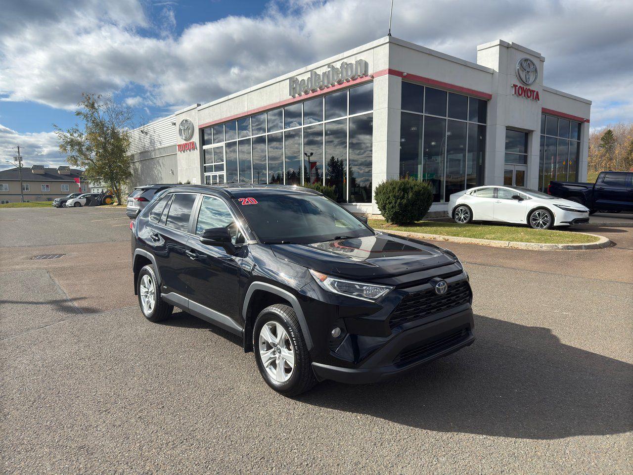 The 2020 Toyota RAV4 Hybrid XLE combines eco-friendly performance with advanced technology and comfort. Powered by a 2.5L hybrid engine, it offers excellent fuel efficiency and a smooth driving experience. Inside, the cabin features premium fabric seats, an 8-way power-adjustable drivers seat, heated front seats, and a leather-wrapped steering wheel. Dual-zone automatic climate control and a power rear door add convenience, while the 7 touchscreen with Apple CarPlay and Android Auto compatibility keeps you connected. Safety is a top priority with Toyota Safety Sense 2.0, which includes Lane Departure Alert, Dynamic Radar Cruise Control, Pre-Collision System with Pedestrian and Bicycle Detection, Blind Spot Monitor with Rear Cross-Traffic Alert, and more. The exterior is equipped with LED headlights, fog lamps, rain-sensing wipers, and a power moonroof. The RAV4 Hybrid XLE also includes advanced safety features like 8 airbags, electronic stability control, and brake assist for added peace of mind. With a spacious interior, versatile seating, and a host of tech and safety features, the 2020 RAV4 Hybrid XLE offers a well-rounded, efficient ride.

<span>Why choose to buy from Fredericton Toyota? When you buy from us, you’re not just a customer — you’re part of the family, and we’re committed to providing exceptional service every step of the way.</span>