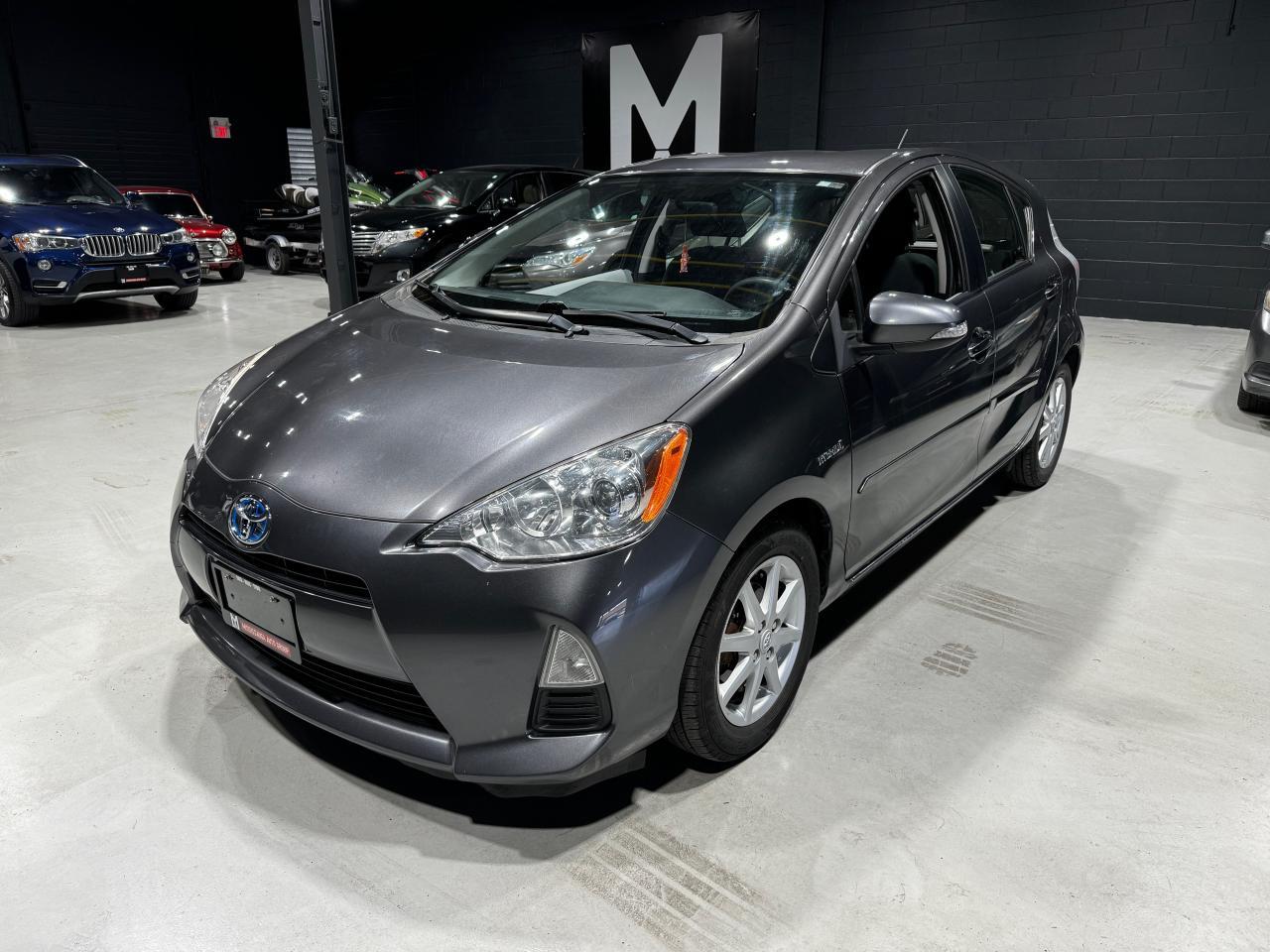 <p><strong>2014 Toyota Prius C Hybrid </strong></p><p>Looking for a reliable, fuel-efficient vehicle? Check out this <strong>2014 Toyota Prius C Hybrid</strong>, now available at M&L Autos!</p><p><strong>Key Features:</strong></p><ul><li><strong>Hybrid Efficiency</strong>: Get incredible gas mileage with the Prius Cs renowned hybrid engine, offering up to 53 MPG city / 46 MPG highway.</li><li><strong>Mileage</strong>: 121,500 KMS</li><li><strong>Transmission</strong>: Automatic CVT</li><li><strong>Exterior Color</strong>: Brown</li><li><strong>Interior</strong>: Spacious and comfortable with cloth upholstery in excellent condition.</li><li><strong>Technology</strong>: Equipped with Bluetooth connectivity, a touch-screen display, and a rear-view camera for added convenience and safety.</li><li><strong>Safety</strong>: Includes Toyota’s advanced safety features like traction control, ABS, and multiple airbags.</li><li><strong>Clean Title</strong>: One-owner vehicle with a clean title and no accidents.</li></ul><p>This Prius C is perfect for city driving or long road trips, offering unmatched fuel savings without compromising comfort and style. Its in excellent condition both inside and out, with routine maintenance records available upon request.</p><p><strong>Contact us today at 905-439-7689 today!</strong></p>