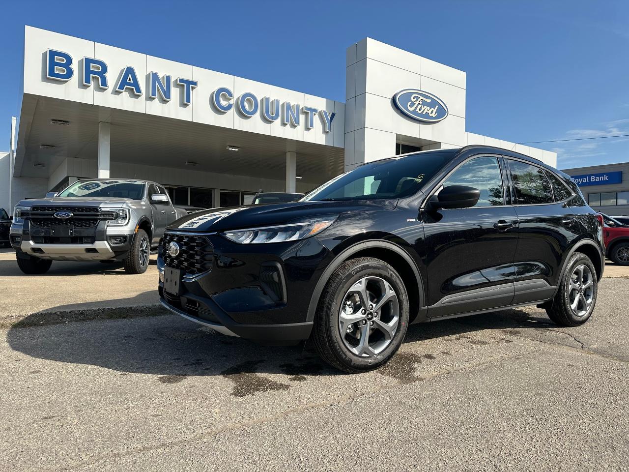 <p>THIS BLACK 2025 FORD ESCAPE ST SWD IS NICELY EQUIPPED WITH 1.5L ECOBOOST, COLD WEATHER PACKAGE: INCLUDES HEATED STEERING WHEEL, HEATED SEATS, REMOTE START AND ALSO A TECH PACKAGE: INCLUDES ADAPTIVE CRUISE AND LANE KEEPING.</p><p> </p><p class=MsoNoSpacing><span style=mso-spacerun: yes;> </span>Brant County Ford is a family owned dealership and has been a proud member of the Brantford community for over 40 years!</p><p class=MsoNoSpacing><br/></p><p class=MsoNoSpacing><br/>** PURCHASE PRICE ONLY (Includes) Fords Delivery Allowance</p><p class=MsoNoSpacing><br/>** See dealer for details.</p><p class=MsoNoSpacing>*Please note all prices are plus HST and Licencing.</p><p class=MsoNoSpacing>* Prices in Ontario, Alberta and British Columbia include OMVIC/AMVIC fee (where applicable), accessories, other dealer installed options, administration and other retailer charges.</p><p class=MsoNoSpacing>*The sale price assumes all applicable rebates and incentives (Delivery Allowance/Non-Stackable Cash/3-Payment rebate/SUV Bonus/Winter Bonus, Safety etc</p><p class=MsoNoSpacing>All prices are in Canadian dollars (unless otherwise indicated). Retailers are free to set individual prices.</p>