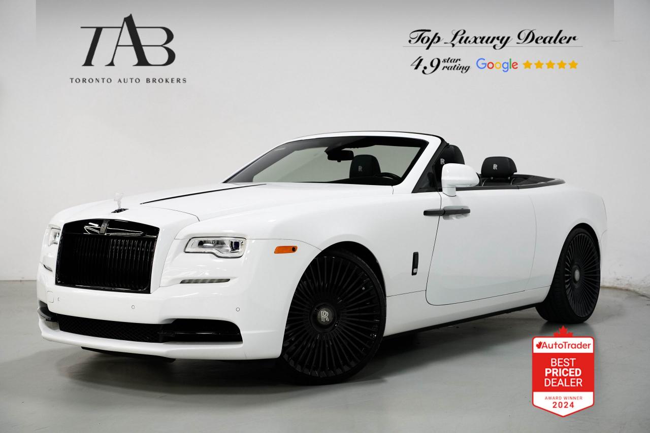 This 2016 Rolls-Royce Dawn Base V12 has Clean Carfax Report. It is the epitome of open-top luxury, blending timeless elegance with cutting-edge engineering. As a cabriolet, it offers an unmatched open-air driving experience, allowing drivers to bask in the beauty of the surroundings while enjoying the ultimate in luxury craftsmanship. Every detail, from the hand-stitched leather interior to the bespoke design touches, exudes exclusivity. The powerful V12 engine ensures that performance is never compromised, delivering smooth and effortless power. Riding on 24-inch forge wheels, this Dawn combines the grace of a classic Rolls-Royce with a modern, head-turning appeal.

Key Features:

6.6L twin-turbocharged V12 engine
563 horsepower 
24-inch forged wheels 
Cabriolet design 
Eight-speed automatic transmission
Premium leather interior with bespoke detailing
Hand-crafted wood veneer trim
Adaptive cruise control with full stop and go
Night vision camera 
Heated and ventilated front seats
Soft-closing doors
Bespoke audio system with immersive sound
Keyless entry and push-button start
Air suspension 
LED adaptive headlights for improved visibility
Heads-up display 
Navigation system with real-time traffic updates

NOW OFFERING 3 MONTH DEFERRED FINANCING PAYMENTS ON APPROVED CREDIT.

WE OFFER THE BEST FINANCE RATES, AND DONT CHARGE ANY FINANCING FEE

Looking for a top-rated pre-owned luxury car dealership in the GTA? Look no further than Toronto Auto Brokers (TAB)! Were proud to have won multiple awards, including the 2024 AutoTrader Best Priced Dealer, 2024 CBRB Dealer Award, the Canadian Choice Award 2024, the 2024 BNS Award, the 2024 Three Best Rated Dealer Award, and many more!

With 30 years of experience serving the Greater Toronto Area, TAB is a respected and trusted name in the pre-owned luxury car industry. Our 30,000 sq.Ft indoor showroom is home to a wide range of luxury vehicles from top brands like BMW, Mercedes-Benz, Audi, Porsche, Land Rover, Jaguar, Aston Martin, Bentley, Maserati, and more. 

At TAB, were committed to providing a no-pressure environment and honest work ethics. As a family-owned and operated business, we treat every customer like family and ensure that every interaction is a positive one. Come experience the TAB Lifestyle at its truest form, luxury car buying has never been more enjoyable and exciting!

We offer a variety of services to make your purchase experience as easy and stress-free as possible. From competitive and simple financing and leasing options to extended warranties, aftermarket services, and full history reports on every vehicle, we have everything you need to make an informed decision. We welcome every trade, even if youre just looking to sell your car without buying, and when it comes to financing or leasing, we offer same day approvals, with access to over 50 lenders, including all of the banks in Canada. Feel free to check out your own Equifax credit score without affecting your credit score, simply click on the Equifax tab above and see if you qualify.

So if youre looking for a luxury pre-owned car dealership in Toronto, look no further than TAB! We proudly serve the GTA, including Toronto, Etobicoke, Woodbridge, North York, York Region, Vaughan, Thornhill, Richmond Hill, Mississauga, Scarborough, Markham, Oshawa, Peteborough, Hamilton, Newmarket.

Call us today or visit our website to learn more about our inventory and services. And remember, all prices exclude applicable taxes and licensing, and vehicles can be certified at an additional cost of $799.