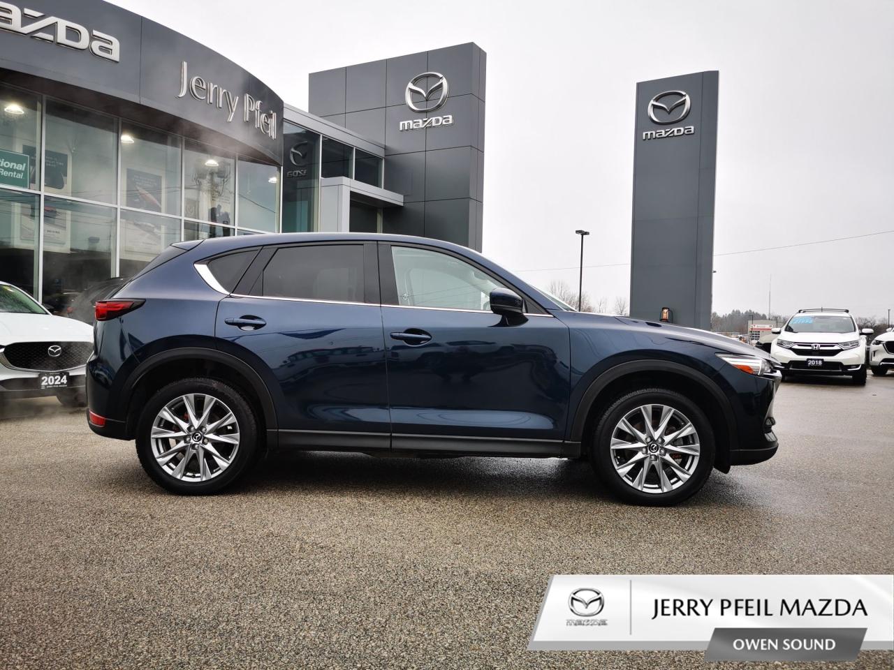 The 2021 Mazda CX-5 GT with Turbo is a sporty compact SUV with a punch. It features a turbocharged 2.5L engine, delivering 250 HP for exhilarating performance. Inside, premium leather seats, a Bose audio system, and an 8.8-inch infotainment screen create a luxury feel. The GT model adds adaptive LED headlights and advanced safety tech like adaptive cruise control. Its design balances sleek aesthetics with dynamic driving, making it a standout choice for those seeking both power and refinement.