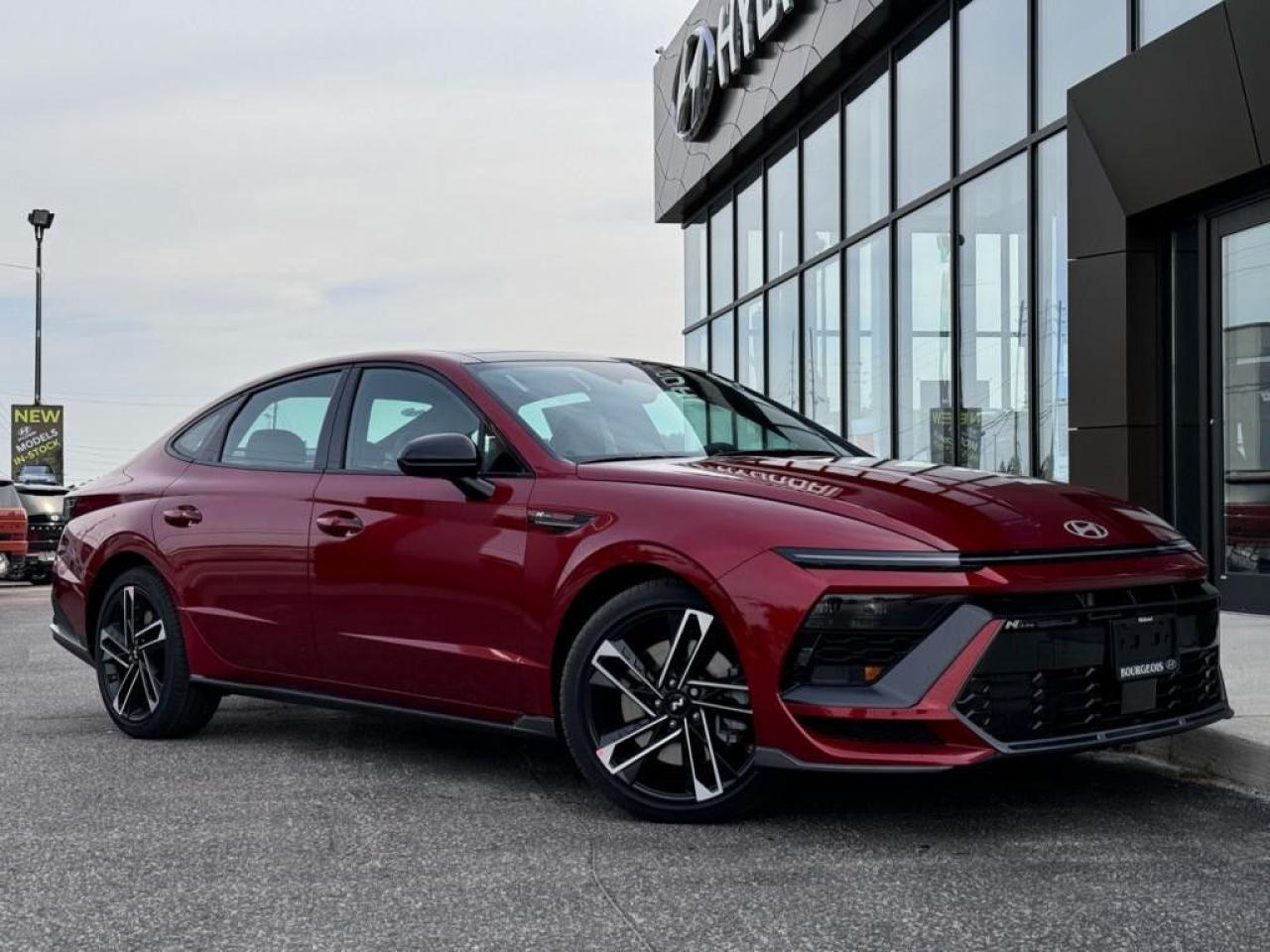 <p>Introducing the pinnacle of sophistication and performance, the new Hyundai Sonata N Line Ultimate, resplendent in a striking red exterior and luxurious black interior. This front-wheel-drive sedan is not just a statement of style but a testament to exhilarating handling that promises an unforgettable driving experience.</p><p>The Sonata N Line Ultimates seductive red body encapsulates both grace and aggression, a perfect counterpart to its opulent black interior thats fully equipped with premium features. From the sleek alloy wheels to the practical yet stylish backup camera, every element is designed with an eye for detail and a focus on luxury. The exteriors bold lines are matched by an interior brimming with amenities such as air conditioning, cooled and heated seats, providing comfort in any season. The presence of a sunroof/moonroof offers an ambient driving experience, allowing natural light or the evening sky to complement the cabins sophisticated styling.</p><p>Technology enthusiasts will be delighted with this Sonata's cutting-edge advancements. An automatic transmission seamlessly delivers power from the 2.5L 4-cylinder engine, ensuring smooth acceleration. The car boasts an impressive array of features including Bluetooth connectivity, smart device integration for uninterrupted connectivity, a navigation system for effortless travel, and a backup camera paired with lane assist for enhanced safety. The satellite radio and superior sound system promise entertainment for every journey, while keyless entry and remote start add a layer of convenience and modernity.</p><p>This Hyundai Sonata N Line Ultimate is tailor-made for those who refuse to compromise between exhilarating performance and uncompromised luxury. Perfect for the discerning buyer seeking a vehicle that excels in both form and function. We invite you to contact the dealership today for more information and to experience firsthand the unparalleled blend of style, comfort, and performance that this Sonata offers.</p> <p><strong>Financing Your Next Vehicle with Bourgeois Midland Hyundai:</strong></p><p>At Bourgeois Midland Hyundai, we make financing your next vehicle simple and stress-free! Our team works with trusted lenders to find flexible options tailored to your budget. Drive away with confidenceapply today!</p><p>Take advantage of our online pre-qualification tool, backed by Equifax and TD Bank to find the payment that works for you. Simply <a href=https://www.bourgeoishyundai.com/pre-qualify-for-financing/ rel=nofollow><strong>CLICK HERE</strong></a> to use our secure online credit tool with no impact to your credit. </p> <p><strong>Why Choose Bourgeois Midland Hyundai and the Bourgeois Auto Group?</strong></p><p>For over 75 years, Bourgeois Auto Group has been delivering exceptional automotive experiences. Our factor trained teams work to ensure you receive the shopping experience you deserve; whether you're looking for a new or new-to-you vehicle. </p><p>Shop 24/7 with our online showroom and chat service, ensuring convenience every step of the way. No hidden fees, full disclosure, and every pre-owned vehicle comes with a Carfax® report for peace of mind.</p><p>We offer a wide selection of pre-owned vehicles, all competitively priced using real-time market data. Get the best deal on your purchase and trade-in with our free Live Market Analysis report.</p><p>Looking to sell your car? We buy any make or modelno purchase required. Our simple to use online trade valuation tool will provide you with a clear, transparent selling experience whether you buy our car or not. </p><p>Backed by hundreds dedicated employees across 4 convenient locations, were here to meet all your automotive needs. Visit us in Midland and explore our inventory or schedule your next service today.</p>