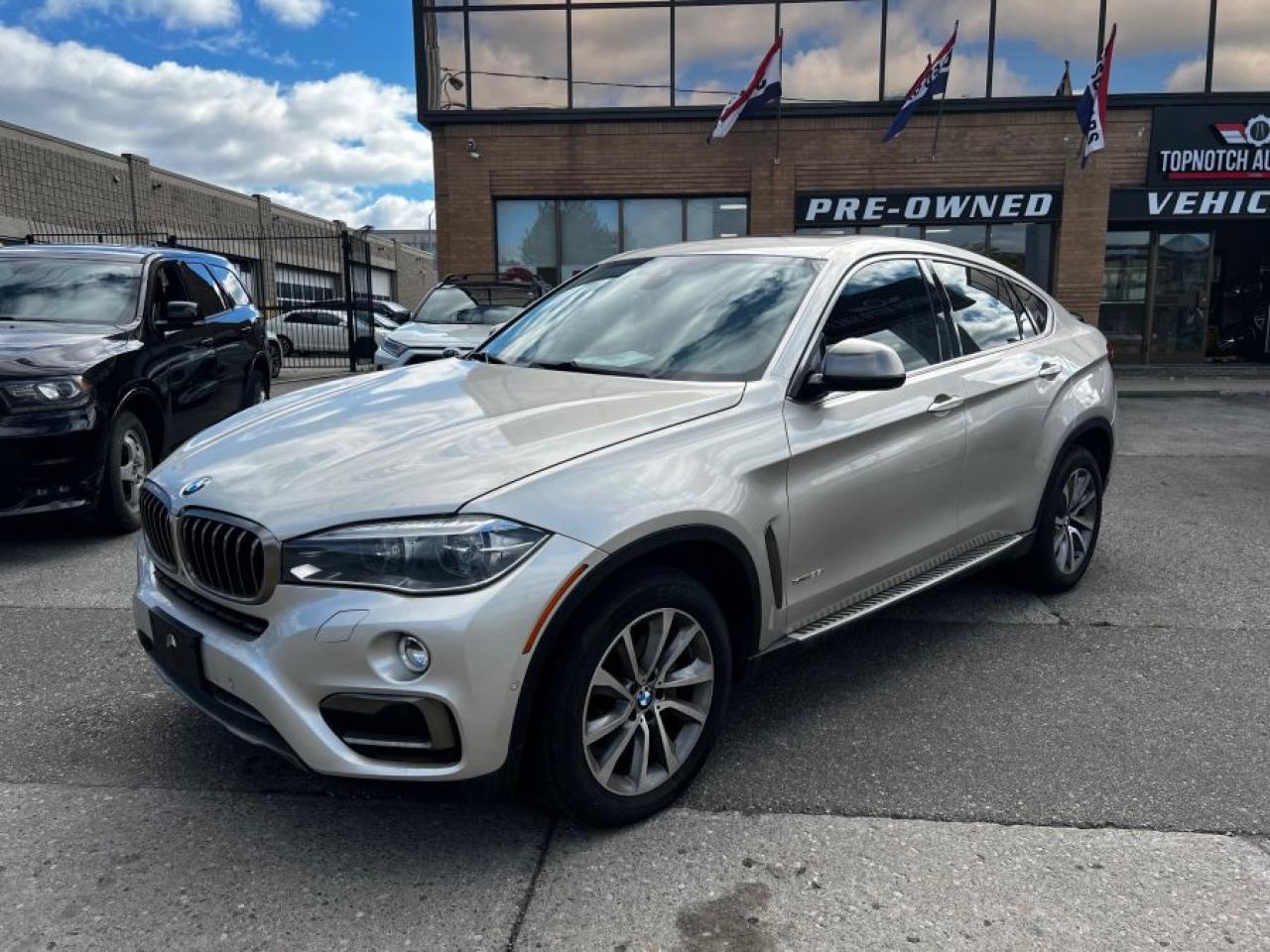 Options Include:<br>- X6 xDrive 35i<br>- HUD<br>- Premium Package Enhanced<br>- LED Lighting Package<br>- Nappa Leather 2 Tone Premium Seating Package<br>- Individual Package<br>- Fineline Oak Wood Trim<br>- Driving Assistant<br>- Park Assistant<br>- Harman Kardon Sound System<br><br>Tax and Licensing Fees are EXTRA!<br>Financing is available!<br>All vehicles can be certified for an additional $799. <br>If not Certified, then as per OMVIC Regulations the vehicle is deemed un-fit, not drivable and<br>not Certified.<br><br>Topnotch Auto Sales is a well established dealer, being in business for well over 14 years. We pride ourselves on how we maintain relationships with our clients, making customer service our first priority. We always aim to keep our large indoor showroom stocked with a diverse inventory, containing the right car for any type of customer. If financing is needed, we provide on-the-spot financing on all vehicle makes and models. We welcome you to give us a call at 416-879-7113, take a look online at tnautosalesinc.com, or come to our establishment at 5161 Steeles Ave W, North York, to take a look at what we have. Looking forward to seeing you!<br>