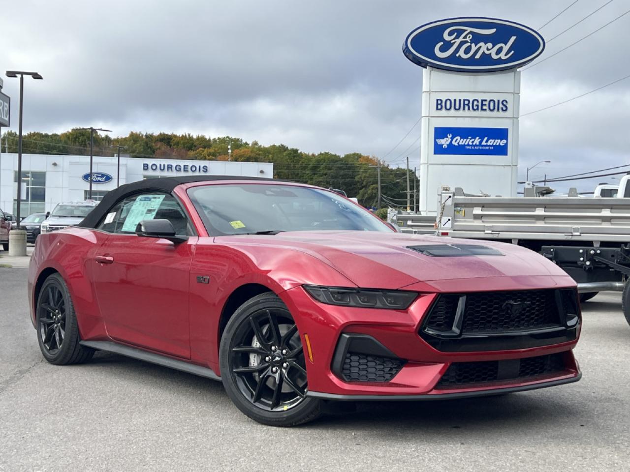 <b>Leather Seats, Ford Co-Pilot360 Assist, Connected Navigation, Premium Audio, 19 inch Aluminum Wheels!</b><br> <br> <br> <br>  The legacy of combining performance, style, and value continues in this fantastic Ford Mustang. <br> <br>From the roar of the engine to its unmistakable style, this all-new Ford Mustang is guaranteed to raise your heart rate and stir your soul. A performance car through and through, this Mustang offers responsive driving dynamics, a comfortable ride and endless smiles by the mile. Its easy to see why the Ford Mustang is still a true American icon.<br> <br> This rapid red metallic tinted clearcoat convertible  has a 6 speed manual transmission and is powered by a  480HP 5.0L 8 Cylinder Engine.<br> <br> Our Mustangs trim level is GT Premium Convertible.  With even more performance, this Mustang GT Premium Convertible comes with an uprated powertrain and a lip spoiler, along with heated and ventilated seats with ActiveX upholstery, a heated steering wheel, dual-zone climate control, upgraded aluminum wheels and an upgraded 9-speaker audio system. The great standard features continue with LED headlights, smart device remote engine start, FordPass Connect tracking, smart device integration, and a dazzling 13.2-inch touchscreen with SYNC 4.0 QNX. Safety features include blind spot detection, lane keeping assist with lane departure warning, automatic emergency braking, and front and rear collision mitigation. This vehicle has been upgraded with the following features: Leather Seats, Ford Co-pilot360 Assist, Connected Navigation, Premium Audio, 19 Inch Aluminum Wheels. <br><br> View the original window sticker for this vehicle with this url <b><a href=http://www.windowsticker.forddirect.com/windowsticker.pdf?vin=1FAGP8FF7R5135308 target=_blank>http://www.windowsticker.forddirect.com/windowsticker.pdf?vin=1FAGP8FF7R5135308</a></b>.<br> <br>To apply right now for financing use this link : <a href=https://www.bourgeoismotors.com/credit-application/ target=_blank>https://www.bourgeoismotors.com/credit-application/</a><br><br> <br/> 4.99% financing for 84 months.  Incentives expire 2024-12-02.  See dealer for details. <br> <br>Discount on vehicle represents the Cash Purchase discount applicable and is inclusive of all non-stackable and stackable cash purchase discounts from Ford of Canada and Bourgeois Motors Ford and is offered in lieu of sub-vented lease or finance rates. To get details on current discounts applicable to this and other vehicles in our inventory for Lease and Finance customer, see a member of our team. </br></br>Discover a pressure-free buying experience at Bourgeois Motors Ford in Midland, Ontario, where integrity and family values drive our 78-year legacy. As a trusted, family-owned and operated dealership, we prioritize your comfort and satisfaction above all else. Our no pressure showroom is lead by a team who is passionate about understanding your needs and preferences. Located on the shores of Georgian Bay, our dealership offers more than just vehiclesits an experience rooted in community, trust and transparency. Trust us to provide personalized service, a diverse range of quality new Ford vehicles, and a seamless journey to finding your perfect car. Join our family at Bourgeois Motors Ford and let us redefine the way you shop for your next vehicle.<br> Come by and check out our fleet of 60+ used cars and trucks and 190+ new cars and trucks for sale in Midland.  o~o