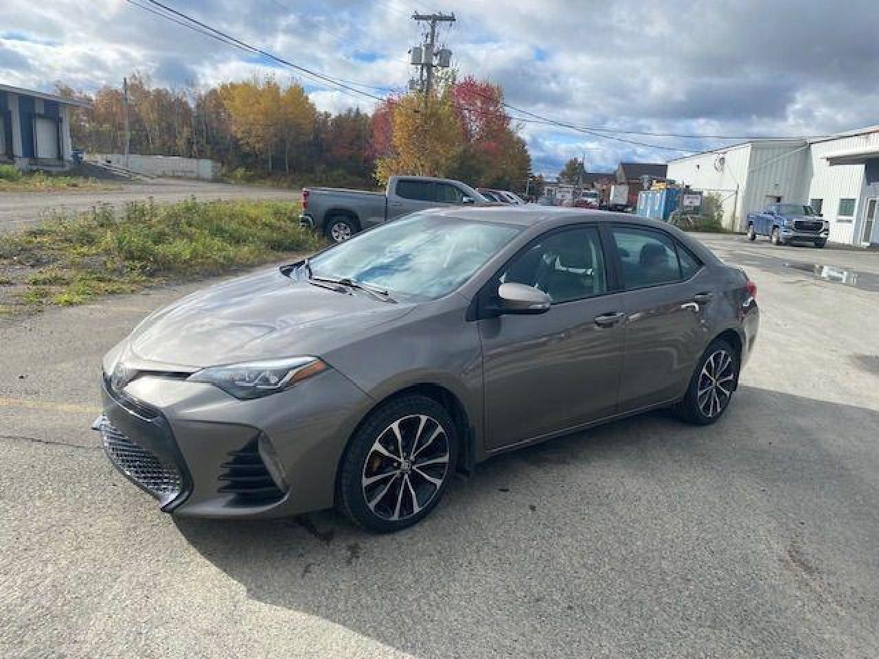 <p>Looking for a reliable and fuel-efficient sedan thats perfect for navigating Canadian roads? Look no further than this 2018 Toyota Corolla from Canadian Auto Sales NL! This stylish Sand exterior with a Dark Grey interior is a beauty inside and out. With a 4-cylinder engine and front-wheel drive, this Corolla is sure to get you where you need to go with ease. Its packed with features that will make your driving experience enjoyable, including a sunroof/moonroof for those sunny days and heated mirrors for the colder months.</p><p>This well-maintained Corolla has only 101,881km on the odometer and is ready to take on whatever adventures you have planned. From its spacious interior with bucket seats for optimal comfort to its convenient power windows and steering, this vehicle provides a seamless driving experience.</p><p>Here are five of the Corollas most sizzling features:</p><ol><li><strong>Sunroof/Moonroof:</strong> Enjoy the open air and breathtaking views with the convenience of a sunroof.</li><li><strong>Heated Mirrors:</strong> No more frozen mirrors on chilly mornings - stay safe and see clearly with heated mirrors.</li><li><strong>Automatic Headlights:</strong> Drive worry-free with automatic headlights that adjust to changing light conditions.</li><li><strong>Cruise Control:</strong> Relax and enjoy the ride with the ease of cruise control on longer journeys.</li><li><strong>Tilt Steering Wheel:</strong> Find the perfect driving position with a tilt steering wheel for optimal comfort.</li></ol><p>Visit Canadian Auto Sales NL today and take this incredible 2018 Toyota Corolla for a test drive!</p><p><em>Powered by AutoIntelligence™ AI</em></p>