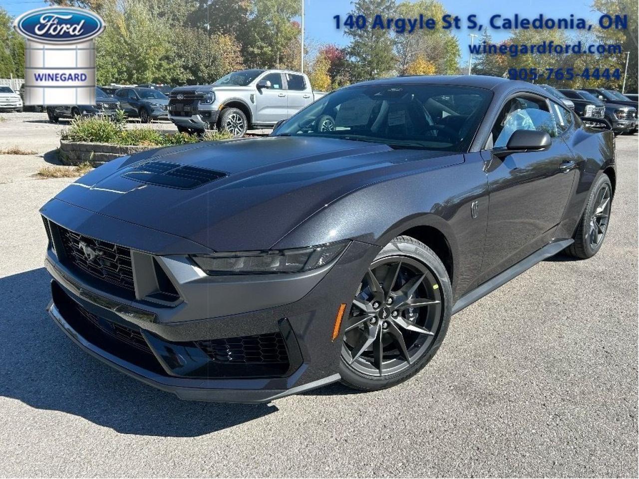 Sport Suspension, Premium Audio, Navigation, Adaptive Cruise Control, Heated Steering Wheel, Climate Control, Blind Spot Detection, Lane Keeping Assist, Lane Departure Warning, 4G Wi-Fi, Proximity Key, LED Lights, SYNC4           Many of our Demonstrators and Loaners are currently available for sale now that 2024 replacement vehicles have arrived. Ask for more details!    Why Buy From Winegard Ford?   * No Administration fees  * No Additional Charges for Factory Orders  * 100 Point Inspection on All Used Vehicles  * Full Tank of Fuel with Every New or Used Vehicle Purchase  * Licensed Ford Accessories Available  *  Window Tinting Available  * Custom Truck Lift and Leveling Packages Available         This seventh-generation Ford Mustang represents the future of ultimate performance muscle cars.      From the roar of the engine to its unmistakable style, this all-new Ford Mustang is guaranteed to raise your heart rate and stir your soul. A performance car through and through, this Mustang offers responsive driving dynamics, a comfortable ride and endless smiles by the mile. Its easy to see why the Ford Mustang is still a true American icon.      This dark matter grey metallic coupe  has a manual transmission and is powered by a  500HP 5.0L 8 Cylinder Engine.      Our Mustangs trim level is Dark Horse. This new Dark Horse trim is engineered for ultimate track performance, with MagneRide dampers, sport-tuned suspension, exclusive performance tires, a wing spoiler for downforce. Off the track, you are treated to niceties such as a premium 12-speaker Bang & Olufsen audio system, adaptive cruise control, a leather/suede-wrapped heated steering wheel, voice-activated dual-zone climate control, heated seats, and an immersive 13.2-inch infotainment screen powered by SYNC 4 QNX, with integrated navigation, smartphone integration, and FordPass Connect mobile hotspot internet access. Safety features also include blind spot detection, evasive steering assist, lane keeping assist with lane departure warning, and automatic emergency braking.      View the original window sticker for this vehicle with this url http://www.windowsticker.forddirect.com/windowsticker.pdf?vin=1FA6P8R03R5507150.     To apply right now for financing use this link : http://www.winegardford.com/financing/application.htm         Weve discounted this vehicle $4000. Total  rebate of $5000 is reflected in the price.   6.99% financing for 84 months.    Buy this vehicle now for the lowest bi-weekly payment of $595.88 with $0 down for 84 months @ 6.99% APR O.A.C. ( taxes included, $13 documentation fee   / Total cost of borrowing $22776   ).  Incentives expire 2025-06-02.  See dealer for details.       o~o