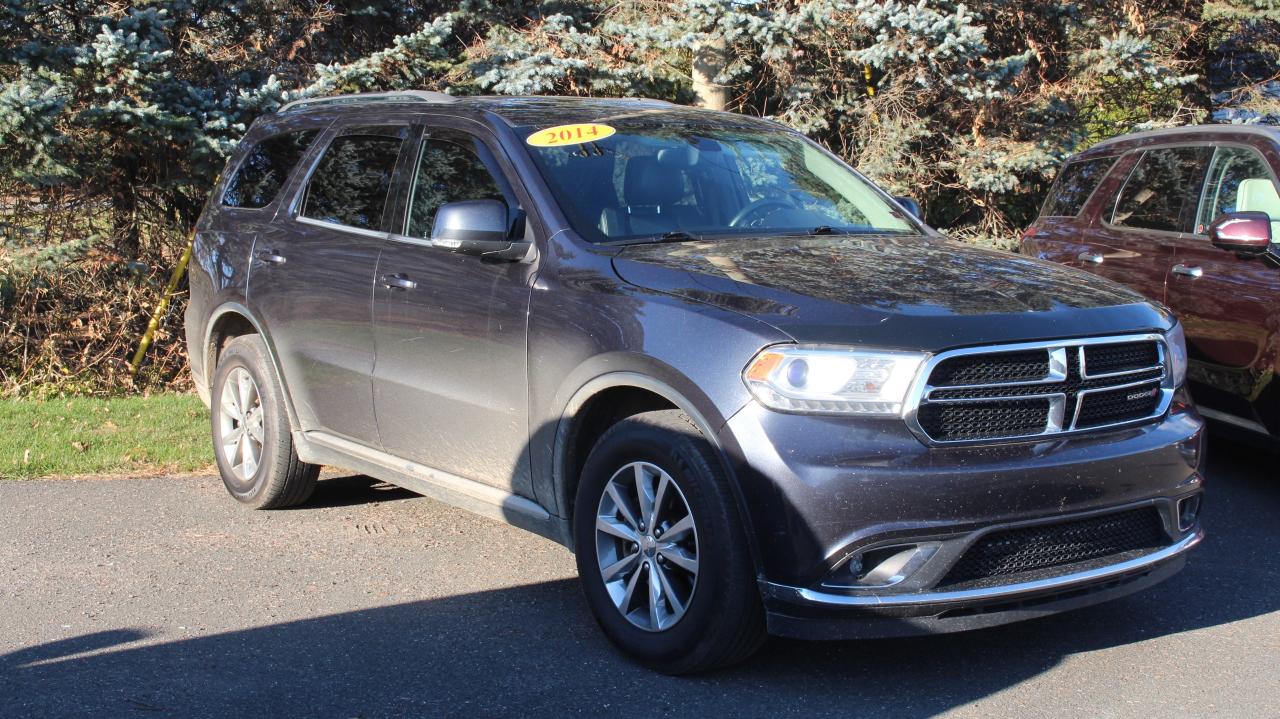 <p>This 2014 Dodge Durango is a head-turning SUV that combines rugged good looks with a comfortable and spacious interior. Its bold blue exterior is sure to make a statement on the road, while its all-wheel drive system provides confidence in any weather conditions. Get ready to experience the open road in style and comfort with this versatile Dodge Durango.</p><p>With its flexible seating configuration, ample cargo space, and powerful engine, this Durango is ideal for families and adventurers alike. Whether youre hauling the kids to soccer practice, embarking on a weekend getaway, or tackling a tough towing job, this SUV can handle it all. Its impressive list of features includes a comprehensive suite of safety technologies, a convenient power liftgate, and a user-friendly infotainment system.</p><p>Legacy Motors Ford has this used Durango waiting for you. Come test drive it today and see for yourself why this SUV is so popular.</p><p>Here are five features that really make this Durango stand out:</p><ul><li><strong>All-Wheel Drive:</strong> Take on any terrain with confidence.</li><li><strong>Heated Leather-Wrapped Steering Wheel:</strong> Stay warm and comfortable all year long.</li><li><strong>Power Liftgate:</strong> Load and unload cargo with ease.</li><li><strong>Parkview Back-Up Camera:</strong> Enjoy peace of mind when backing up.</li><li><strong>Towing Equipment:</strong> Tow your boat, trailer, or camper with confidence.</li></ul><p><em>Powered by AutoIntelligence™ AI</em></p>