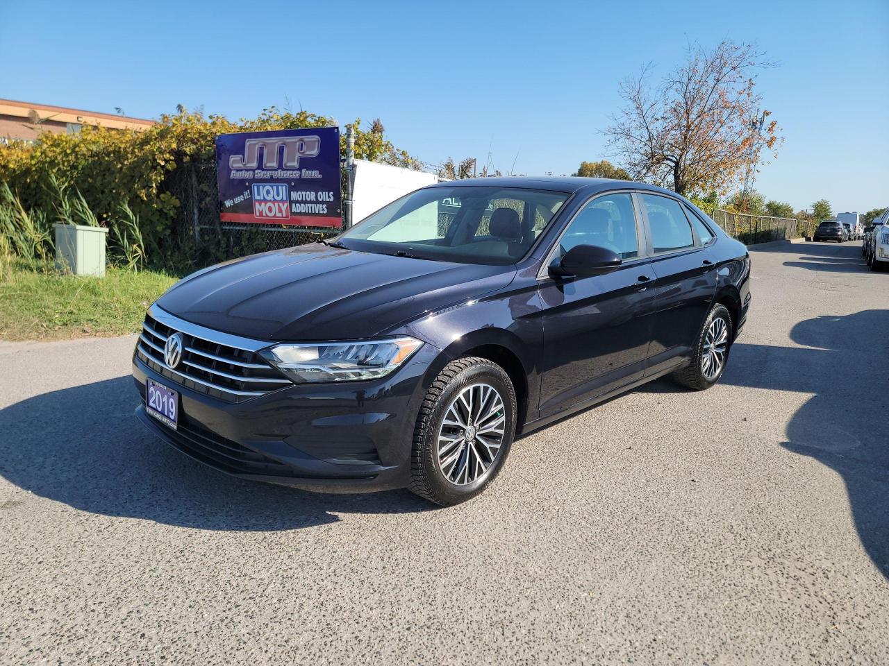 <p>Looking for a stylish and reliable sedan that offers a comfortable and feature-rich driving experience? Look no further than this 2019 Volkswagen Jetta Highline auto, available now at Twin Oaks Auto! This sleek black beauty boasts a luxurious black interior and is equipped with a powerful 4-cylinder engine paired with a smooth-shifting automatic transmission. With only 96,400 km on the odometer, this Jetta is practically brand new and ready to take on the open road.</p><p>Enjoy a smooth and confident ride with features like Adaptive Smart Cruise Control, Blind Spot Monitoring, and a premium sound system that will keep you entertained on every journey. The Jetta also boasts heated seats, a sunroof, and leather upholstery, making it the perfect vehicle for any Canadian winter. This Jetta is perfect for those who value comfort, convenience, and safety.</p><p>Here are five of the most enticing features that set this 2019 Volkswagen Jetta Highline apart:</p><ul><li><strong>Adaptive Smart Cruise Control:</strong> Cruise comfortably and safely, even in stop-and-go traffic.</li><li><strong>Heated Seats:</strong> Stay cozy and warm even on the coldest winter days.</li><li><strong>Leather Seats:</strong> Enjoy a luxurious and stylish interior with the comfort of premium leather seating.</li><li><strong>Sunroof:</strong> Open up the sky and enjoy the fresh air on sunny days.</li><li><strong>Blind Spot Monitoring:</strong> Drive with confidence knowing youre aware of any vehicles in your blind spots.</li></ul><p>Come see this incredible Jetta in person today at Twin Oaks Auto and experience the Volkswagen difference for yourself!</p><p>THE FULL CERTIFICATION COST OF THIS VEHICLE IS AN <strong>ADDITIONAL $690+HST</strong>. THE VEHICLE WILL COME WITH A FULL VALID SAFETY AND 36 DAY SAFETY ITEM WARRANTY. THE OIL WILL BE CHANGED, ALL FLUIDS TOPPED UP AND FRESHLY DETAILED. WE AT TWIN OAKS AUTO STRIVE TO PROVIDE YOU A HASSLE FREE CAR BUYING EXPERIENCE! WELL HAVE YOU DOWN THE ROAD QUICKLY!!! </p><p><strong>Financing Options Available!</strong></p><p><strong>TO CALL US 905-339-3330 </strong></p><p>We are located @ 2470 ROYAL WINDSOR DRIVE (BETWEEN FORD DR AND WINSTON CHURCHILL) OAKVILLE, ONTARIO L6J 7Y2</p><p>PLEASE SEE OUR MAIN WEBSITE FOR MORE PICTURES AND CARFAX REPORTS</p><p><span style=font-size: 18pt;>TwinOaksAuto.Com</span></p>