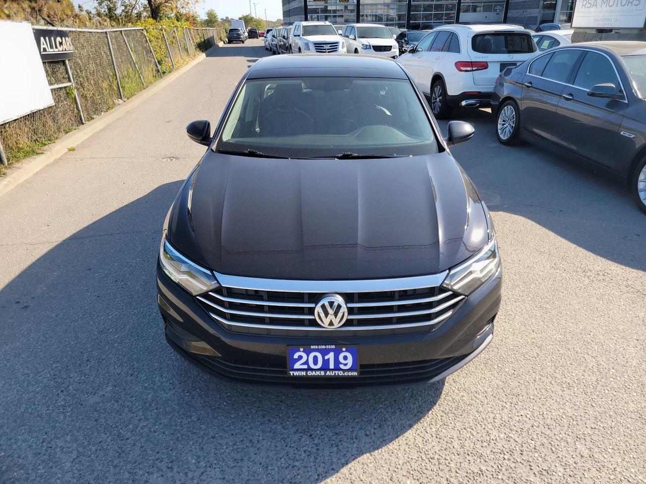 <p>Looking for a stylish and reliable sedan that offers a comfortable and feature-rich driving experience? Look no further than this 2019 Volkswagen Jetta Highline auto, available now at Twin Oaks Auto! This sleek black beauty boasts a luxurious black interior and is equipped with a powerful 4-cylinder engine paired with a smooth-shifting automatic transmission. With only 96,400 km on the odometer, this Jetta is practically brand new and ready to take on the open road.</p><p>Enjoy a smooth and confident ride with features like Adaptive Smart Cruise Control, Blind Spot Monitoring, and a premium sound system that will keep you entertained on every journey. The Jetta also boasts heated seats, a sunroof, and leather upholstery, making it the perfect vehicle for any Canadian winter. This Jetta is perfect for those who value comfort, convenience, and safety.</p><p>Here are five of the most enticing features that set this 2019 Volkswagen Jetta Highline apart:</p><ul><li><strong>Adaptive Smart Cruise Control:</strong> Cruise comfortably and safely, even in stop-and-go traffic.</li><li><strong>Heated Seats:</strong> Stay cozy and warm even on the coldest winter days.</li><li><strong>Leather Seats:</strong> Enjoy a luxurious and stylish interior with the comfort of premium leather seating.</li><li><strong>Sunroof:</strong> Open up the sky and enjoy the fresh air on sunny days.</li><li><strong>Blind Spot Monitoring:</strong> Drive with confidence knowing youre aware of any vehicles in your blind spots.</li></ul><p>Come see this incredible Jetta in person today at Twin Oaks Auto and experience the Volkswagen difference for yourself!</p><p><strong>Additional Certification Cost</strong>: The full certification cost for this vehicle is <strong>$790 + HST</strong>.</p><p><strong>What&rsquo;s Included with Certification</strong>:</p><ul><li>The vehicle will be delivered with a <strong>valid safety certification</strong> and a <strong>36-day safety item warranty</strong> for your peace of mind.</li><li>A <strong>fresh oil change</strong> will be performed, and all fluids will be topped up.</li><li>The vehicle will be <strong>professionally detailed</strong>, ensuring it looks and feels like new when you pick it up.</li></ul><p>At <strong>Twin Oaks Auto</strong>, we are committed to providing a <strong>hassle-free car buying experience</strong>. From your first inquiry to driving off in your new car, our goal is to get you on the road quickly and stress-free!</p><p><strong>Financing Options Available!</strong><br />Flexible financing options are available to suit your needs. Contact us for more details.</p><p><strong>Contact Us Today</strong>:<br />📞 <strong>Call Us</strong>: 905-339-3330<br />📍 <strong>Location</strong>: 2470 Royal Windsor Drive, Oakville, Ontario, L6J 7Y2</p><p><br />(Conveniently located between Ford Drive and Winston Churchill Blvd.)</p><p><strong>More Information</strong>:<br />Visit our website at <strong><a href=http://www.twinoaksauto.com>TwinOaksAuto.com</a></strong> to view additional pictures, explore our inventory, and access CARFAX reports.</p><p>&nbsp;</p>